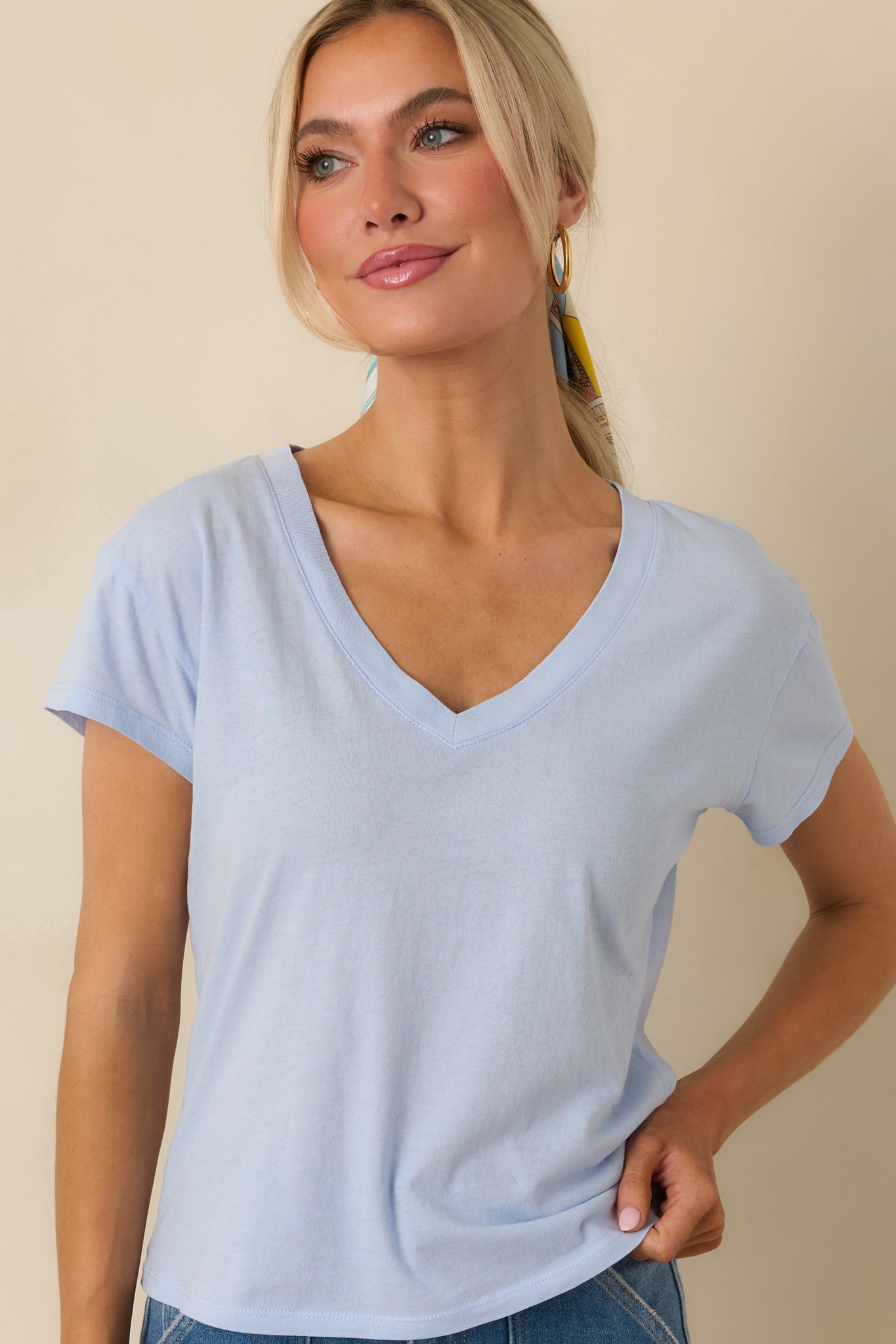 Closer view highlighting the short sleeves, relaxed drape, and smooth lightweight fabric.