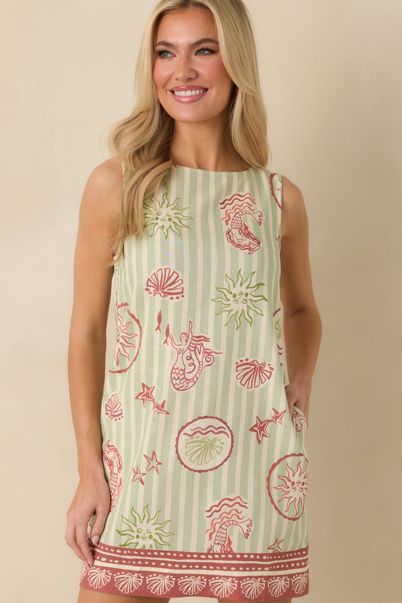 Cropped view focusing on the straight mini hem and relaxed, easy fit of the dress.
