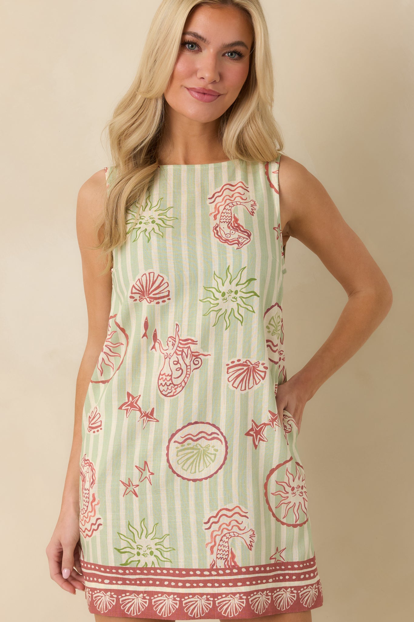 Cropped front view emphasizing the round neckline and sleeveless design of the mini dress.