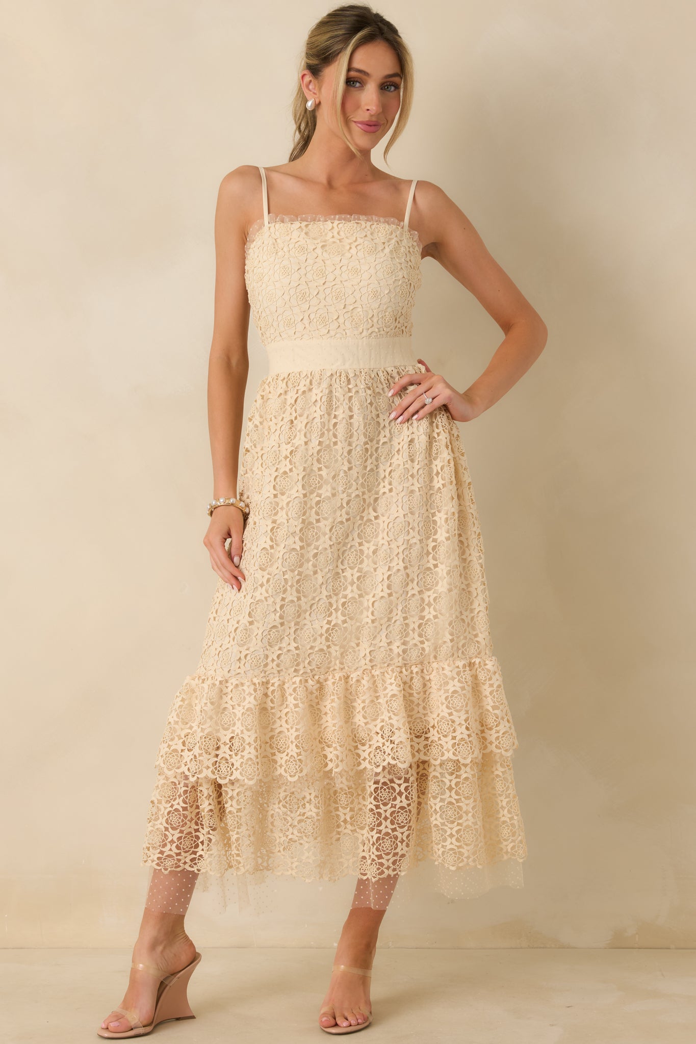Full front view highlighting the fitted bodice and detailed embroidery across the dress.