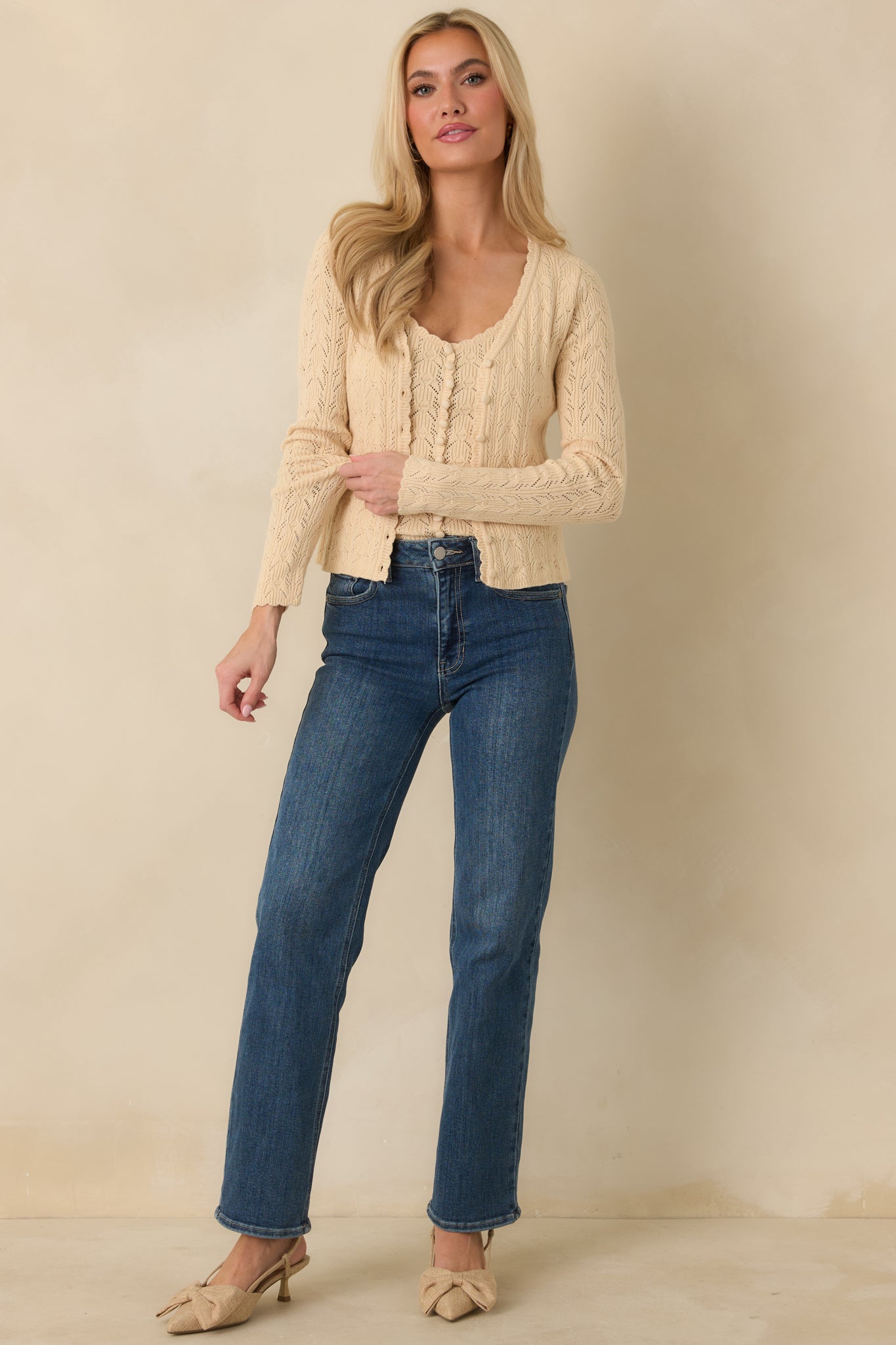 Front view of ivory camisole top highlighting the scallop trim v-neckline and lightweight pointelle knit.