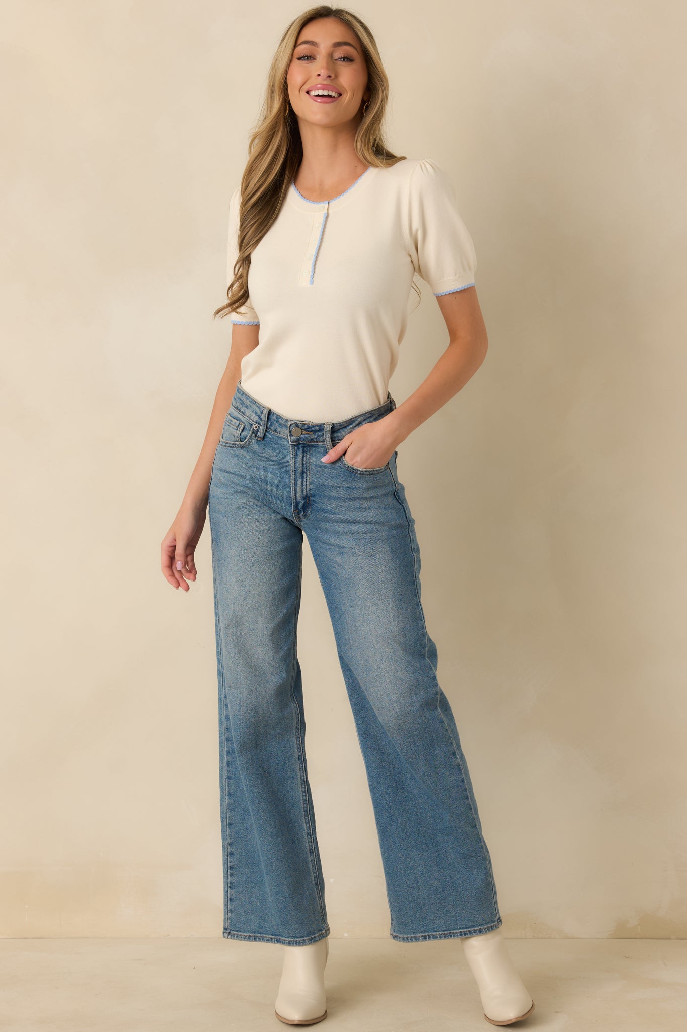 Full-length front view emphasizing the short sleeves, straight hem with contrast detailing, and comfortable knit texture.