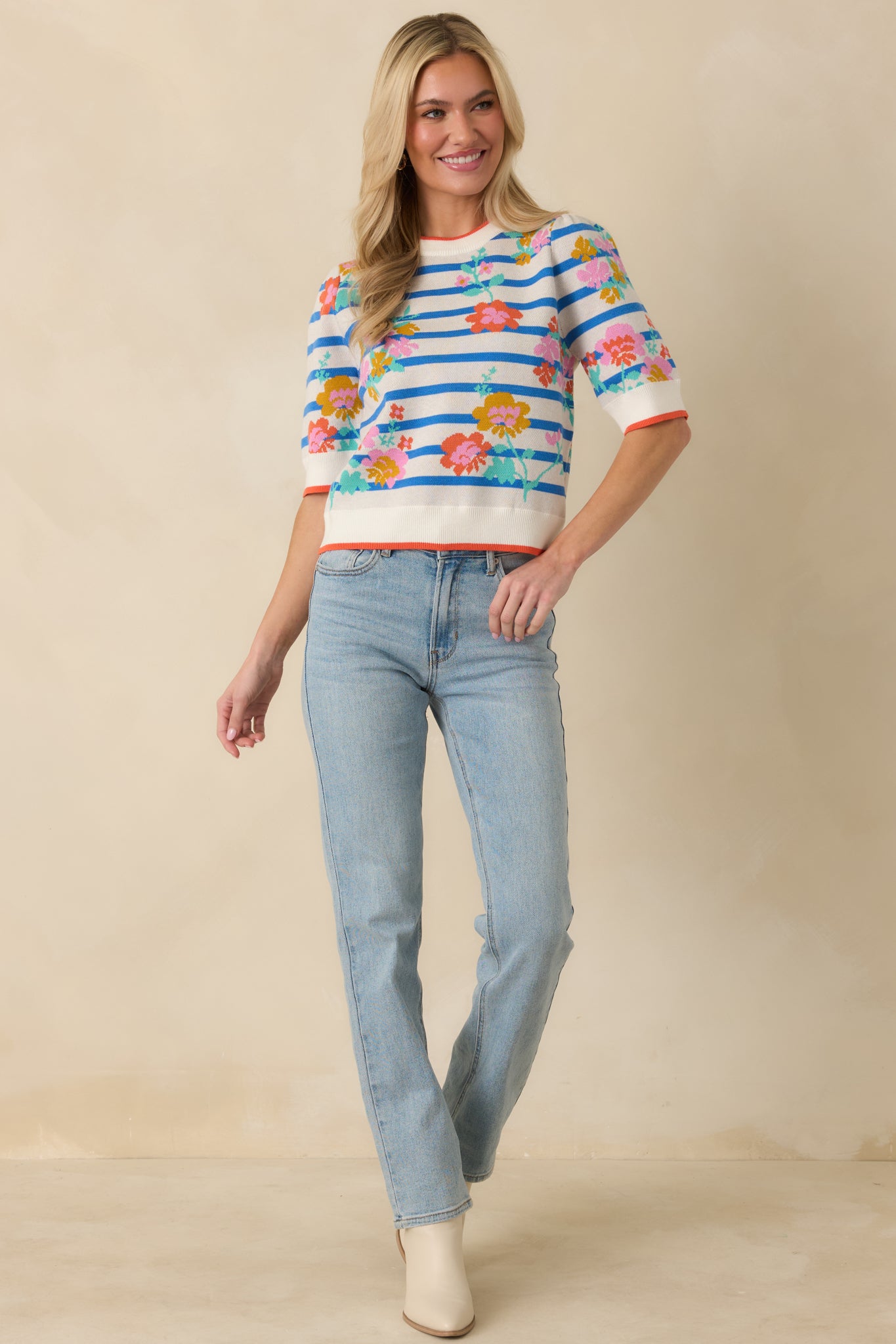 Straight-on front angle showing the straight, easy-fitting silhouette and vibrant striped floral pattern throughout.