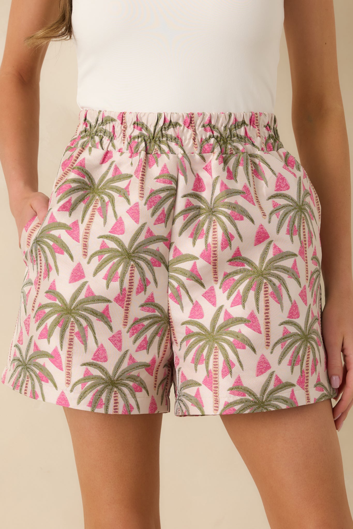 Detail crop highlighting the woven textured fabric and palm jacquard pattern.