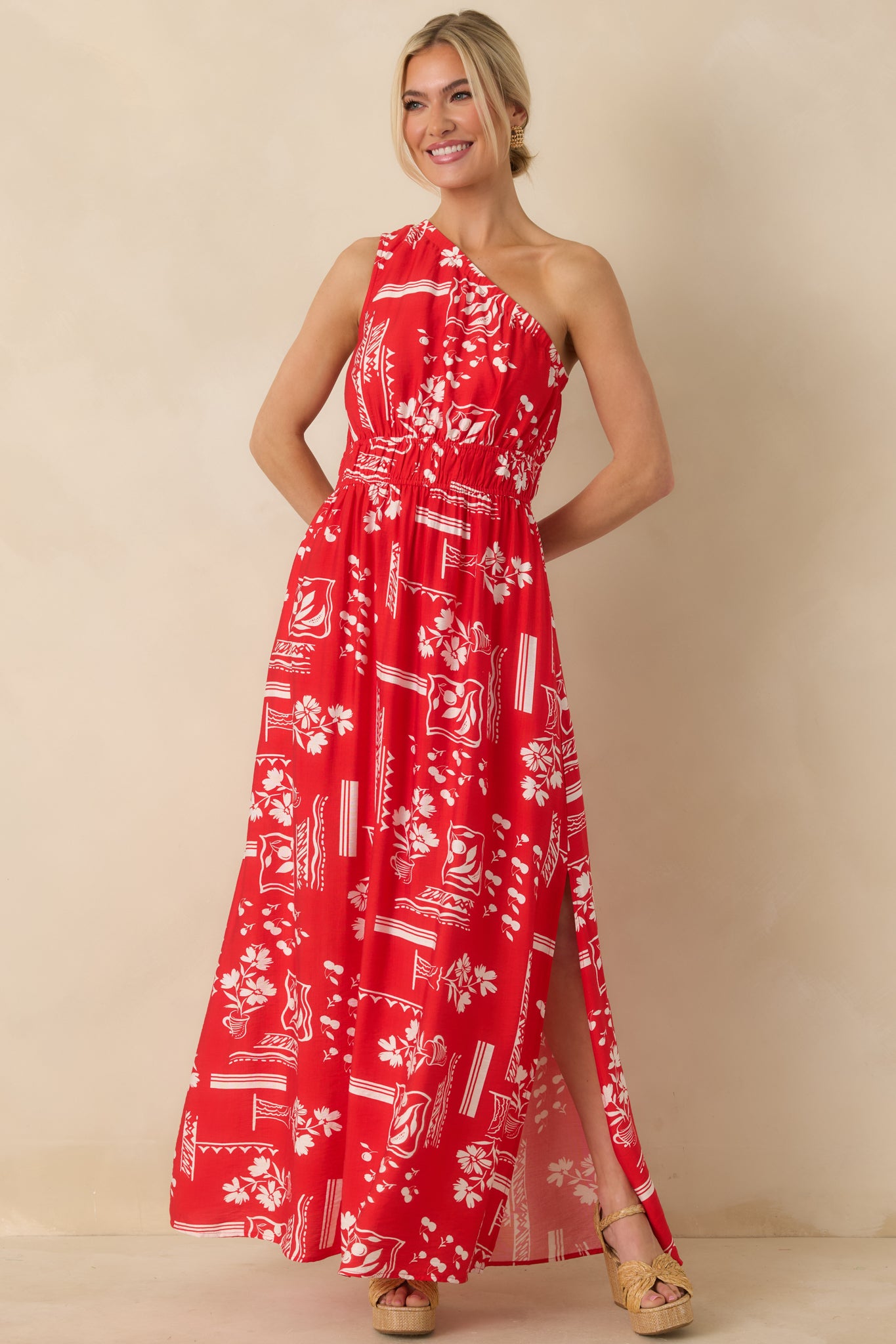 Angled front view showing the geometric floral pattern and movement of the maxi skirt.