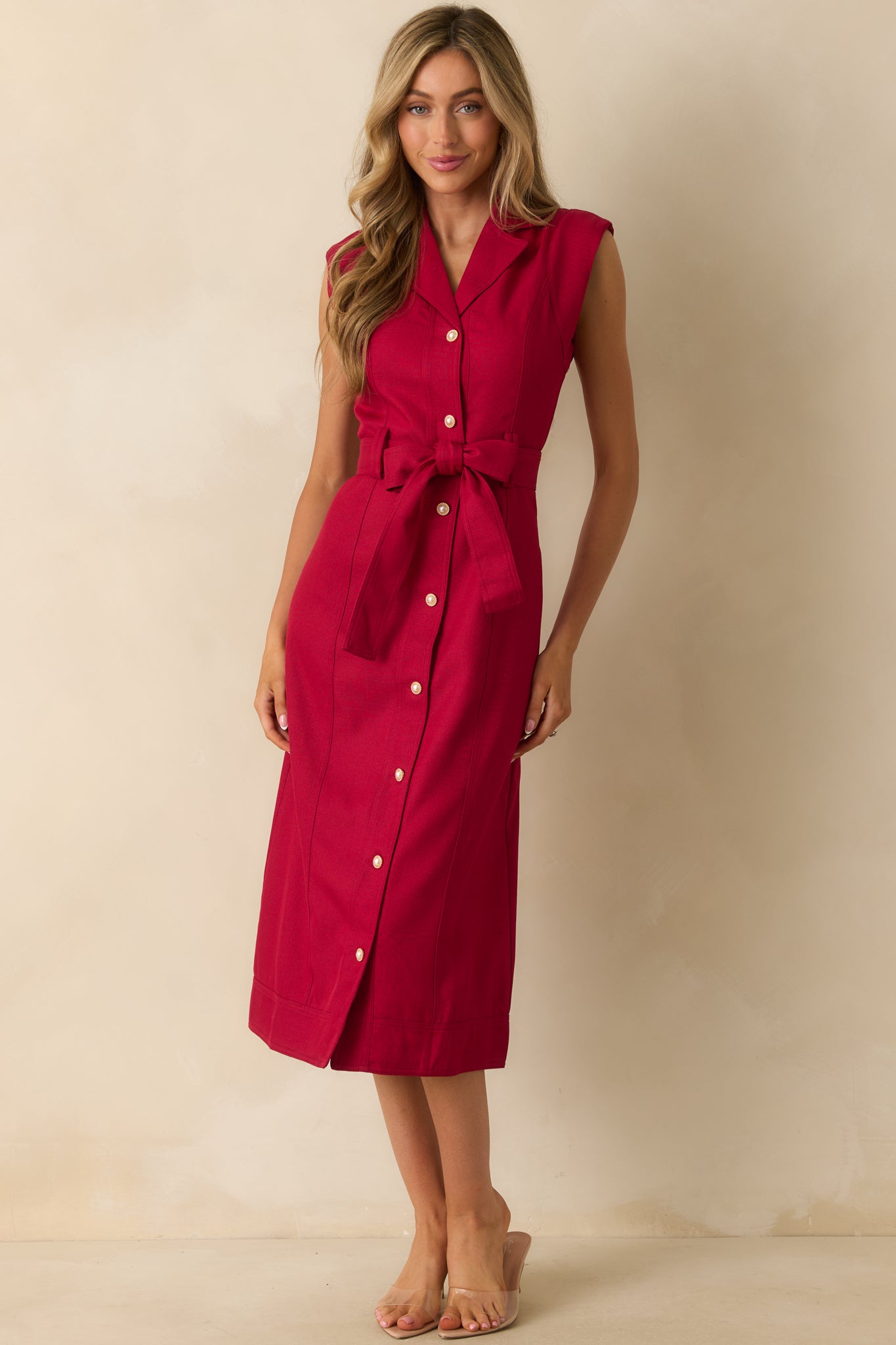 Deep red midi dress highlighting the cap sleeves and smooth drape of the fabric.