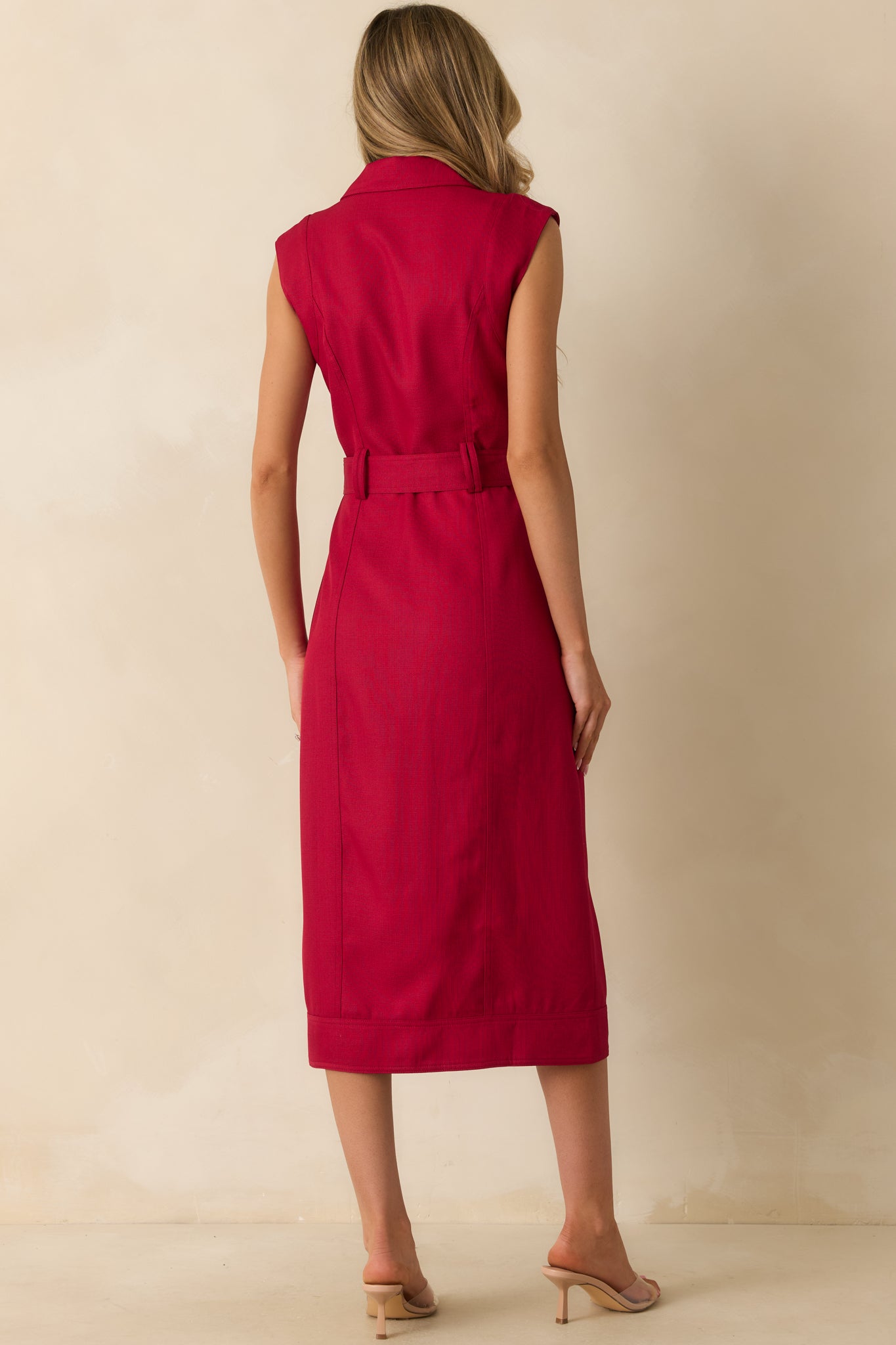Rear view of the red wine midi dress highlighting the smooth fit and belted waistline.