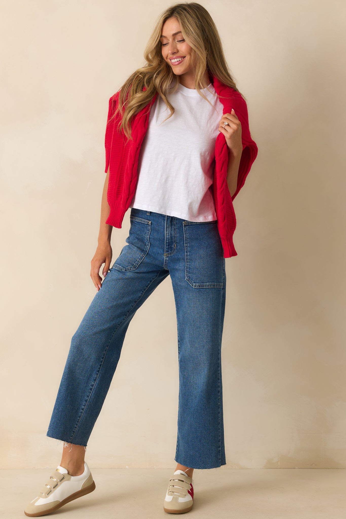 A white tee with a classic crew neckline, short sleeves, and a lightweight jersey material, shown from the front to display its relaxed fit.