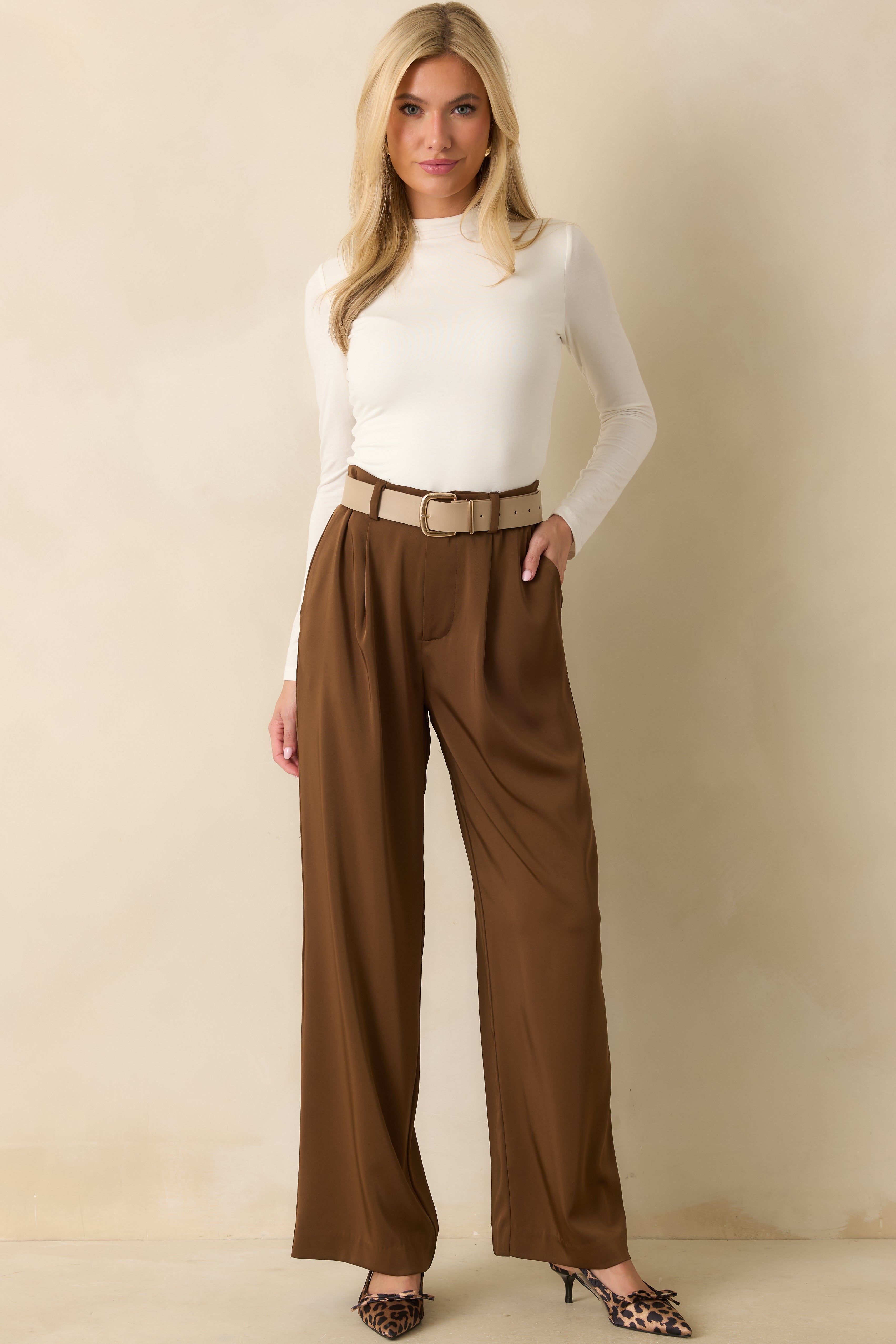 Another full-length shot of the bodysuit showcasing its ivory color and fitted silhouette.