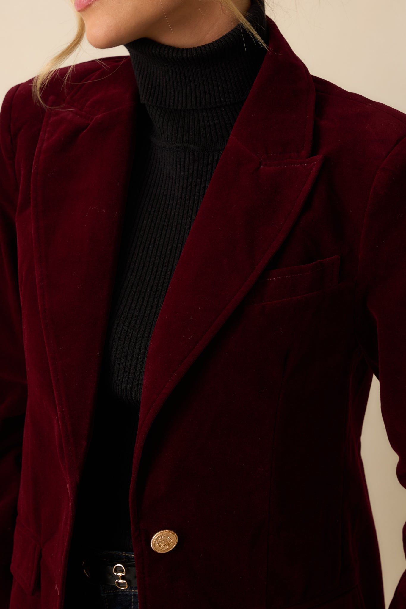 Detailed shot of the rich merlot velvet fabric, lapel, and button texture for a refined finish.