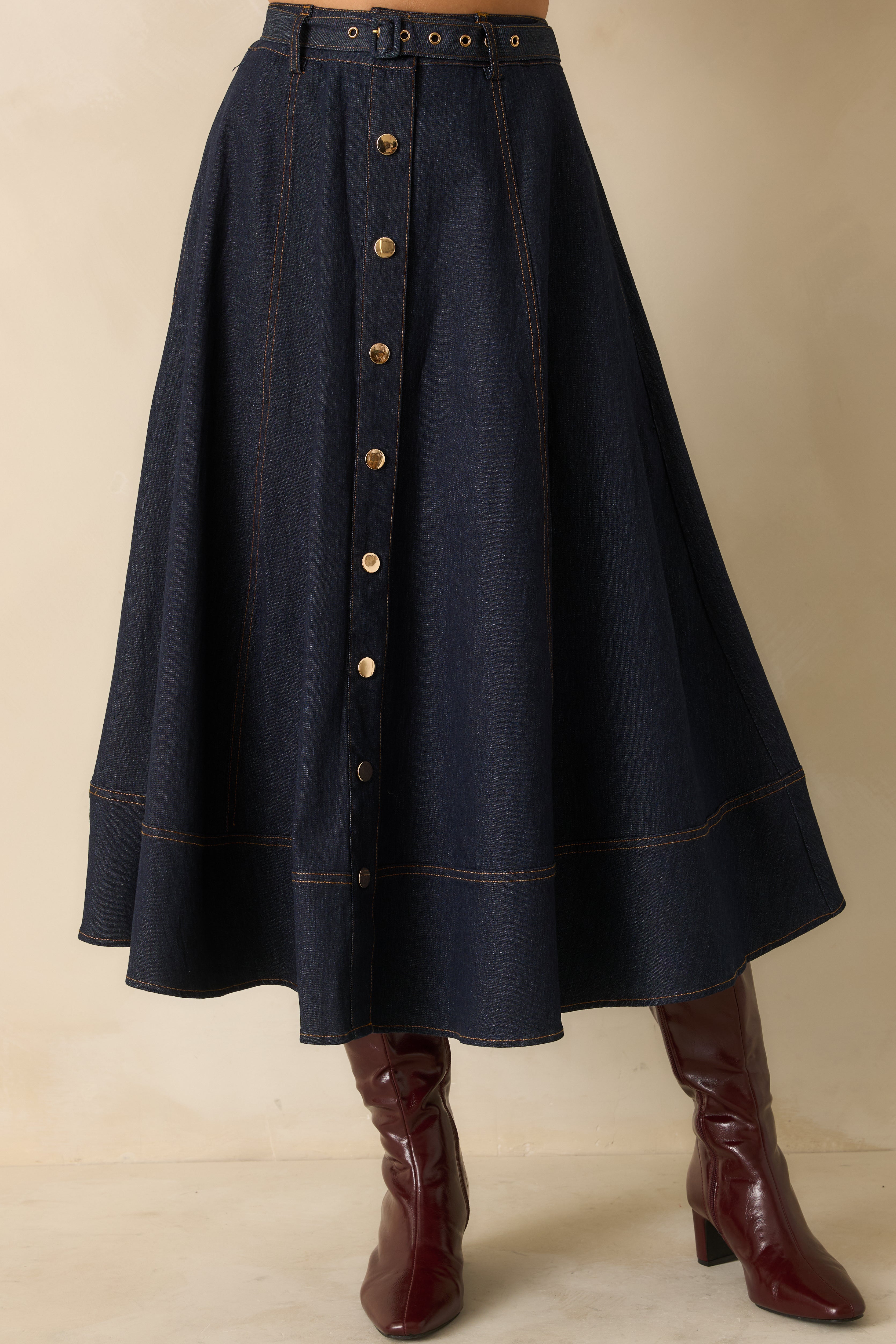 Cropped lower view highlighting the hemline and subtle stitching of the skirt.