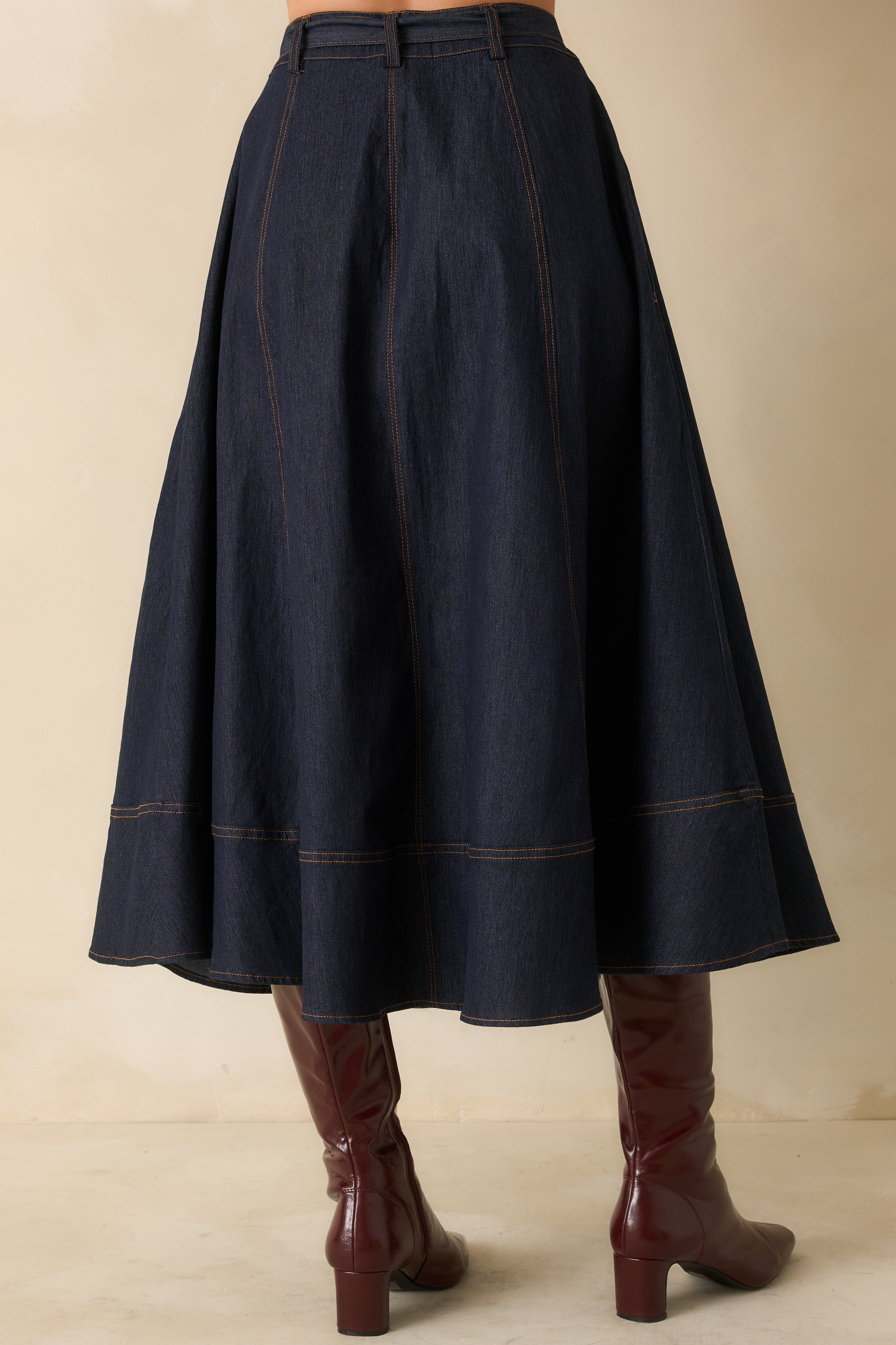 Back view of the skirt showing the high-rise fit, back panels, and pocket placement.