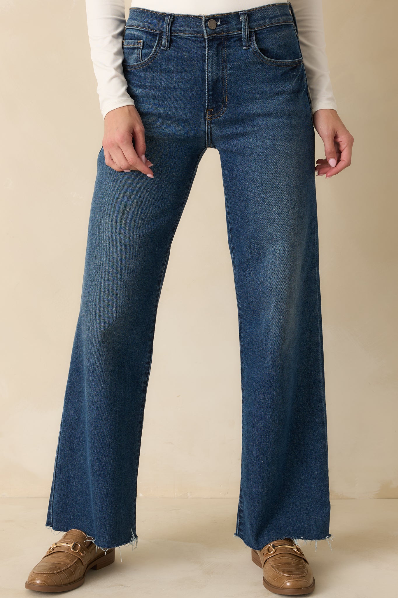 Cropped front view highlighting the straight-leg shape and dark wash denim.