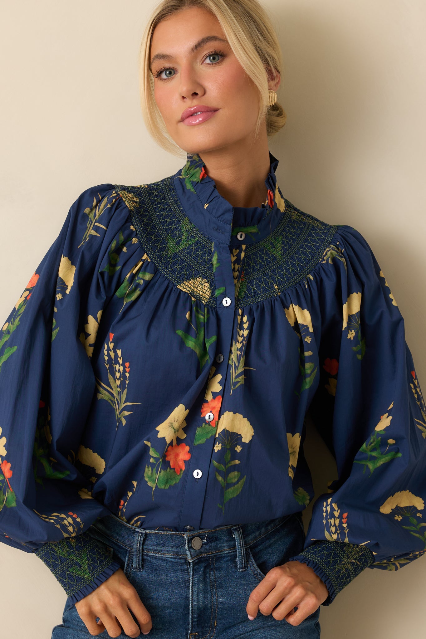 Cropped view emphasizing the button-front closure and floral print texture.