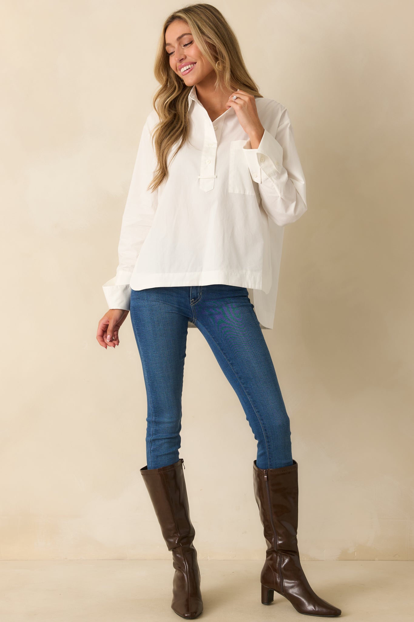 Woven cotton blouse emphasizing the smooth fabric and classic collar design.
