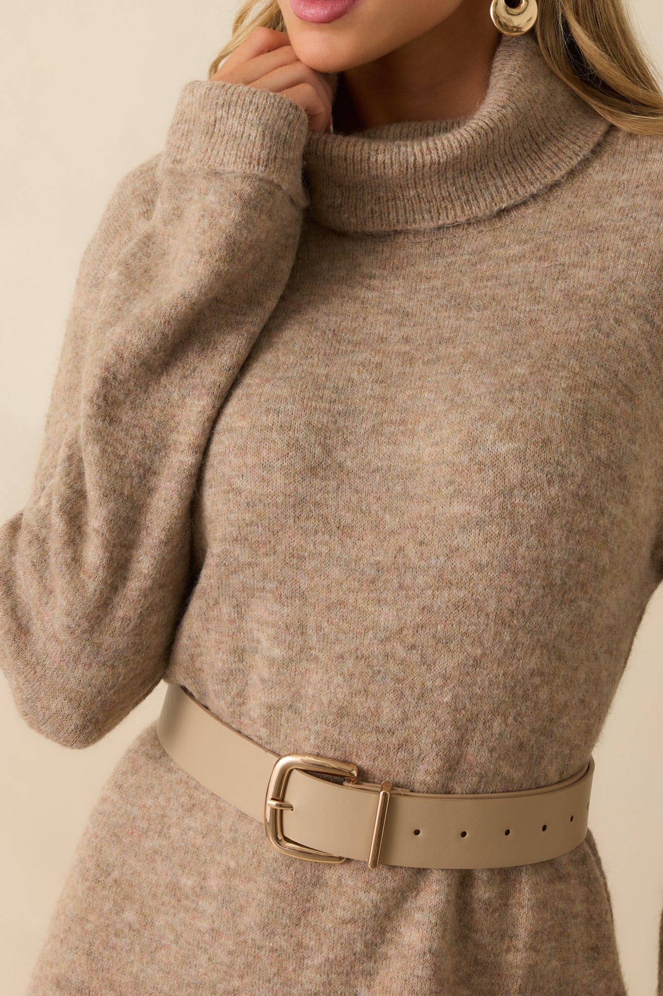 Close-up view of the beige knit fabric showing the soft brushed texture and fine knit detailing.
