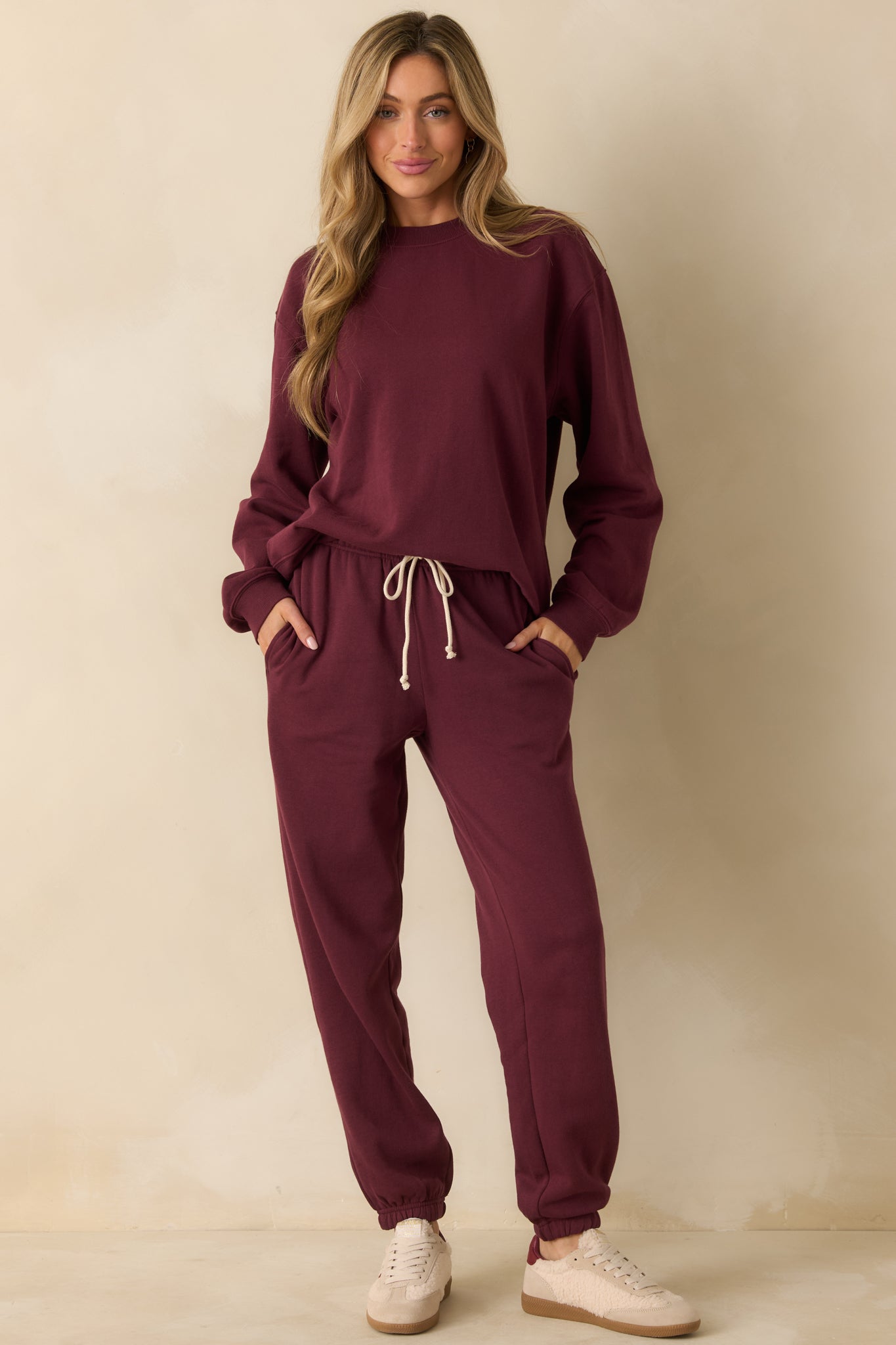 Soft fleece sweatshirt in a rich merlot tone, styled with long sleeves and ribbed trim.