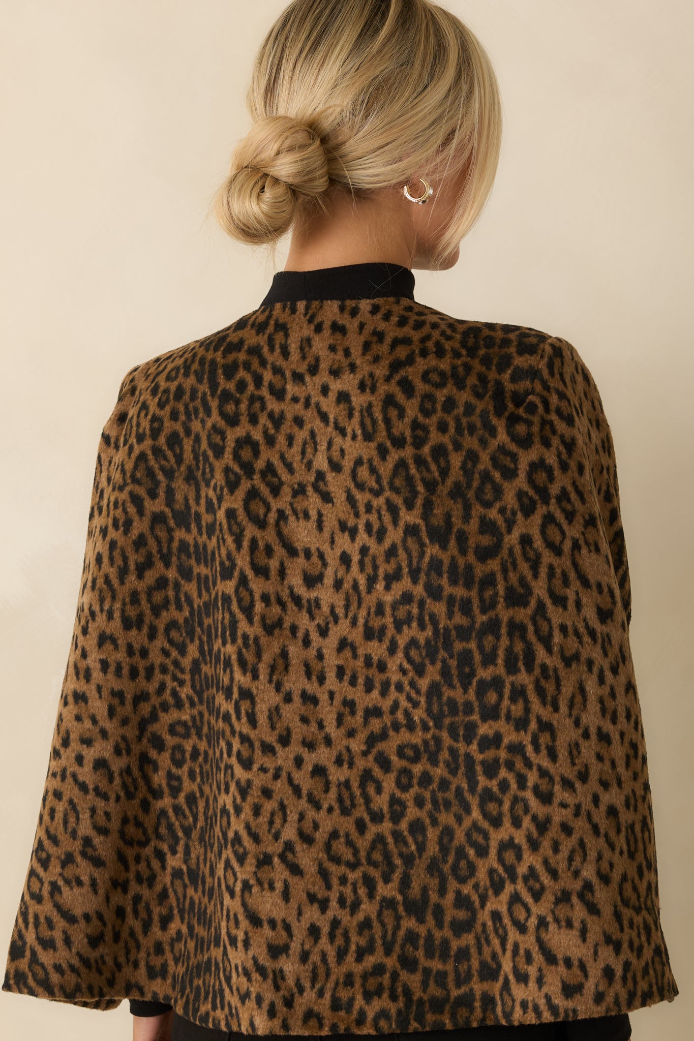 Rear view of the blazer displaying clean back lines and polished straight hem.