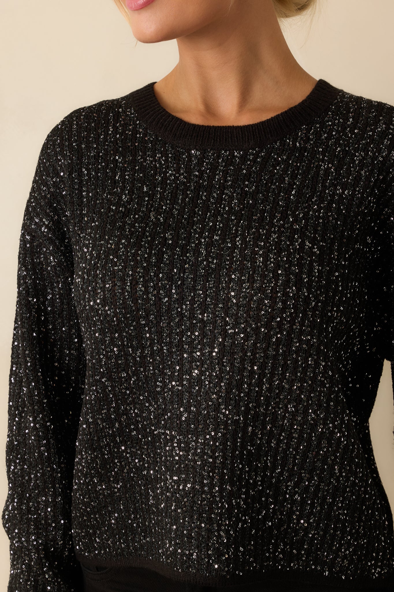 Close-up of the ribbed knit fabric with tonal sequins scattered throughout and textured stitching.