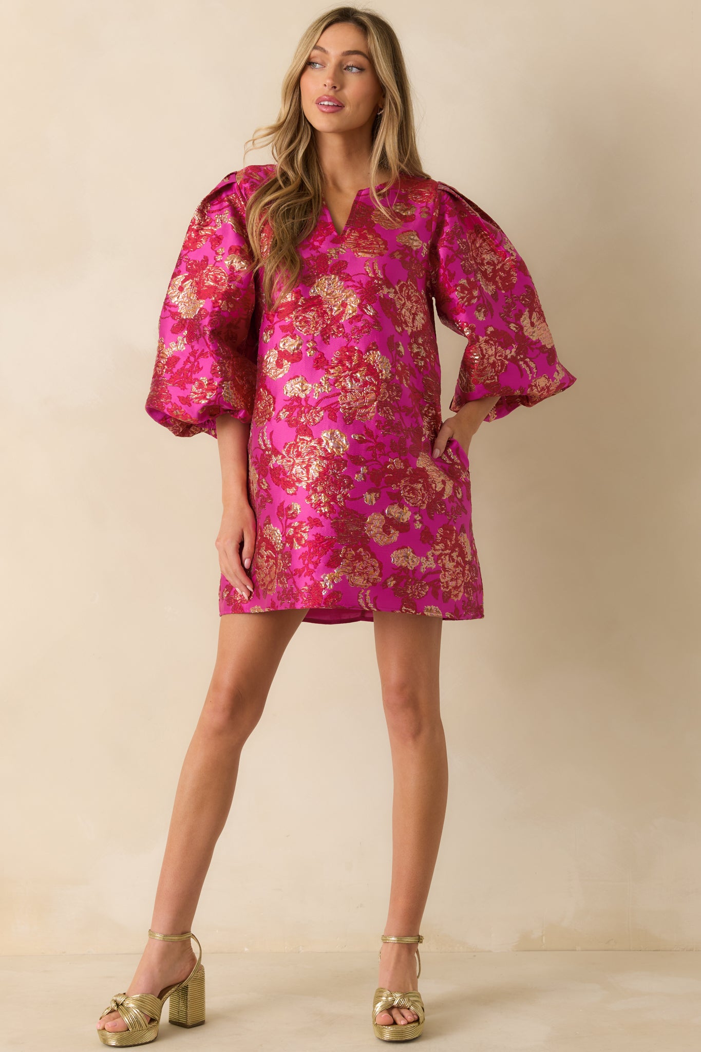 Metallic floral mini dress in vibrant pink, featuring a relaxed shift silhouette and structured look.