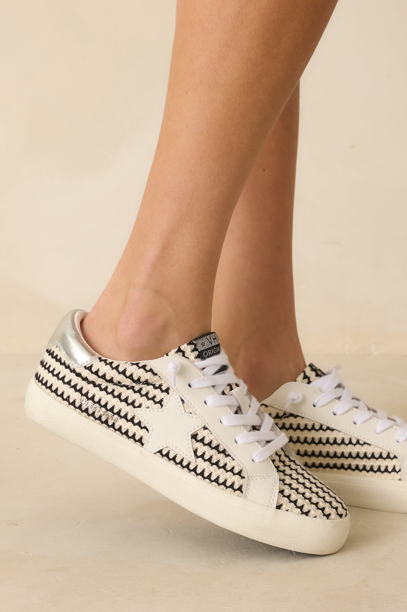 Close-up of the thick sole texture and star embellishments along the upper side.