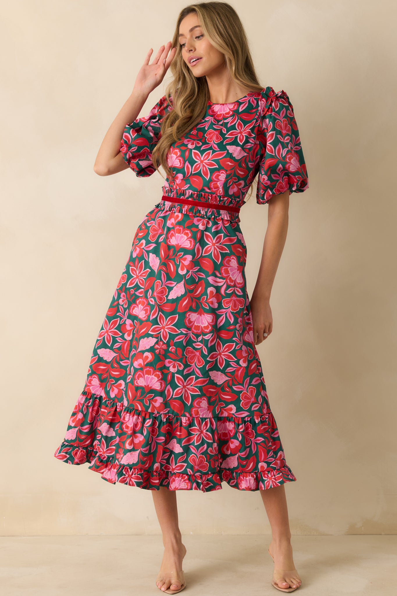 The dress showcases its full-length design with subtle ruffle details and elasticized waist shaping.