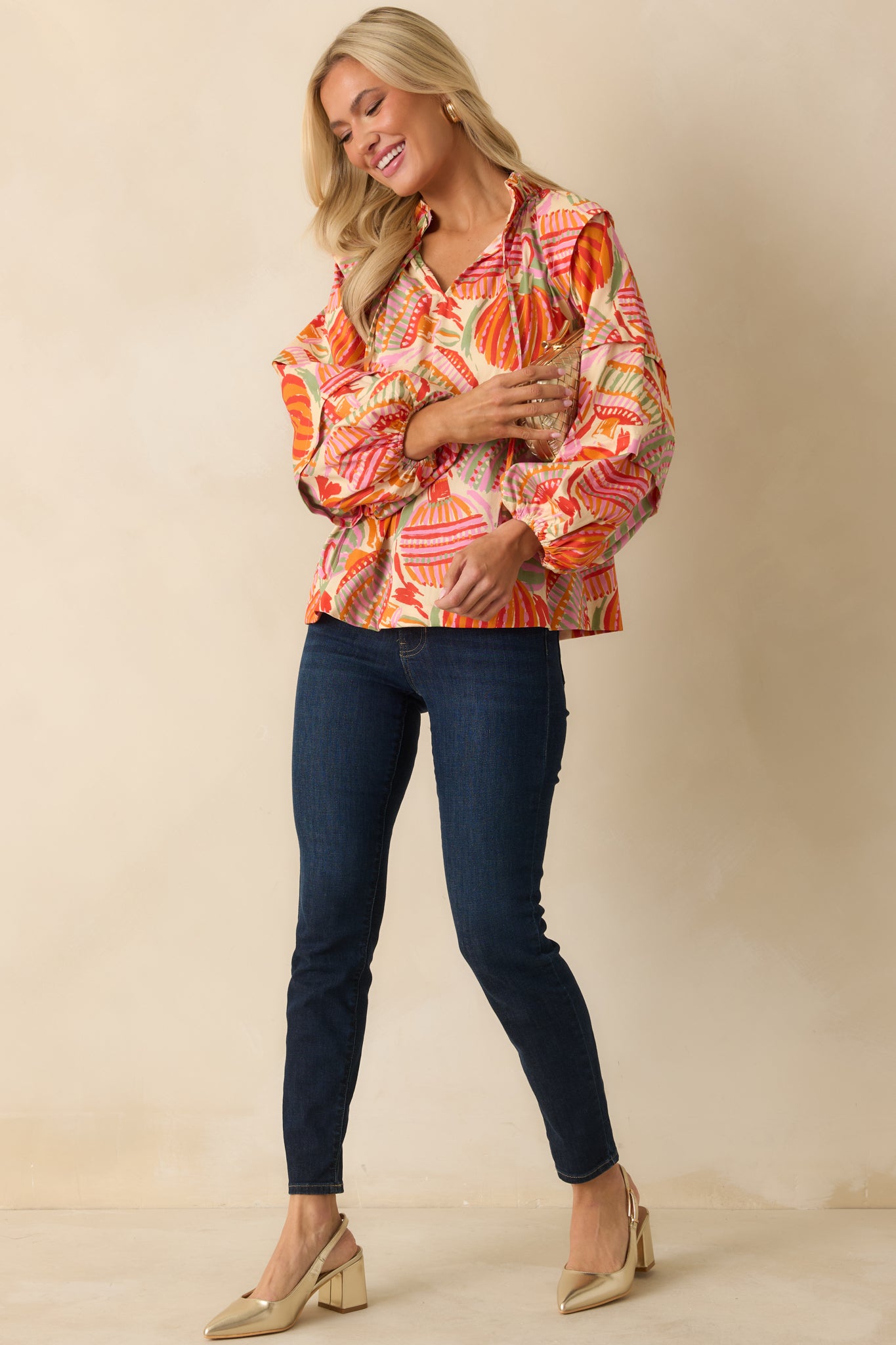 The top shows off its vibrant ornament design paired with long puff sleeves and soft elastic cuffs.