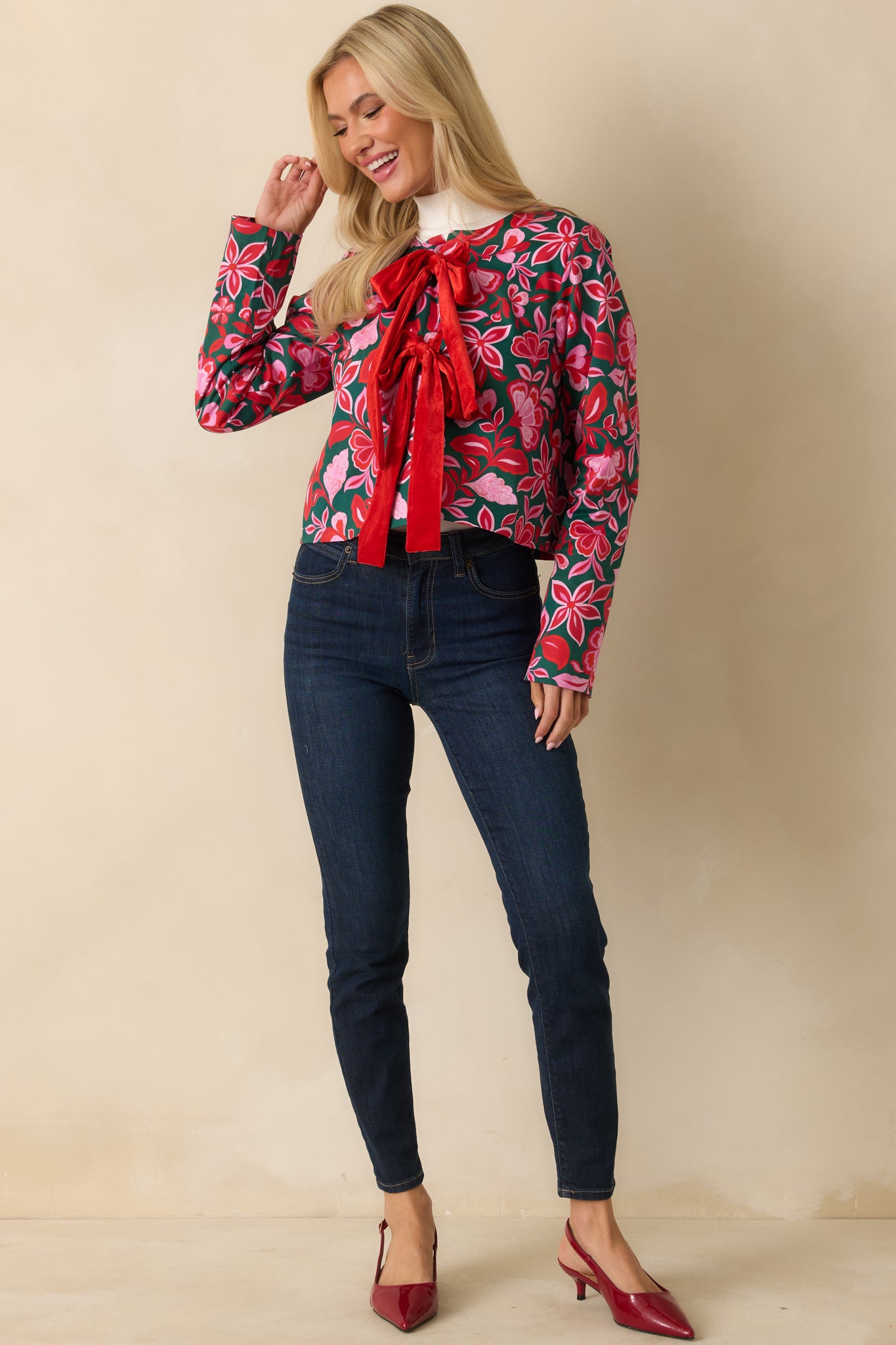 The cropped shape and vibrant print emphasize the structured yet casual fit for layering.