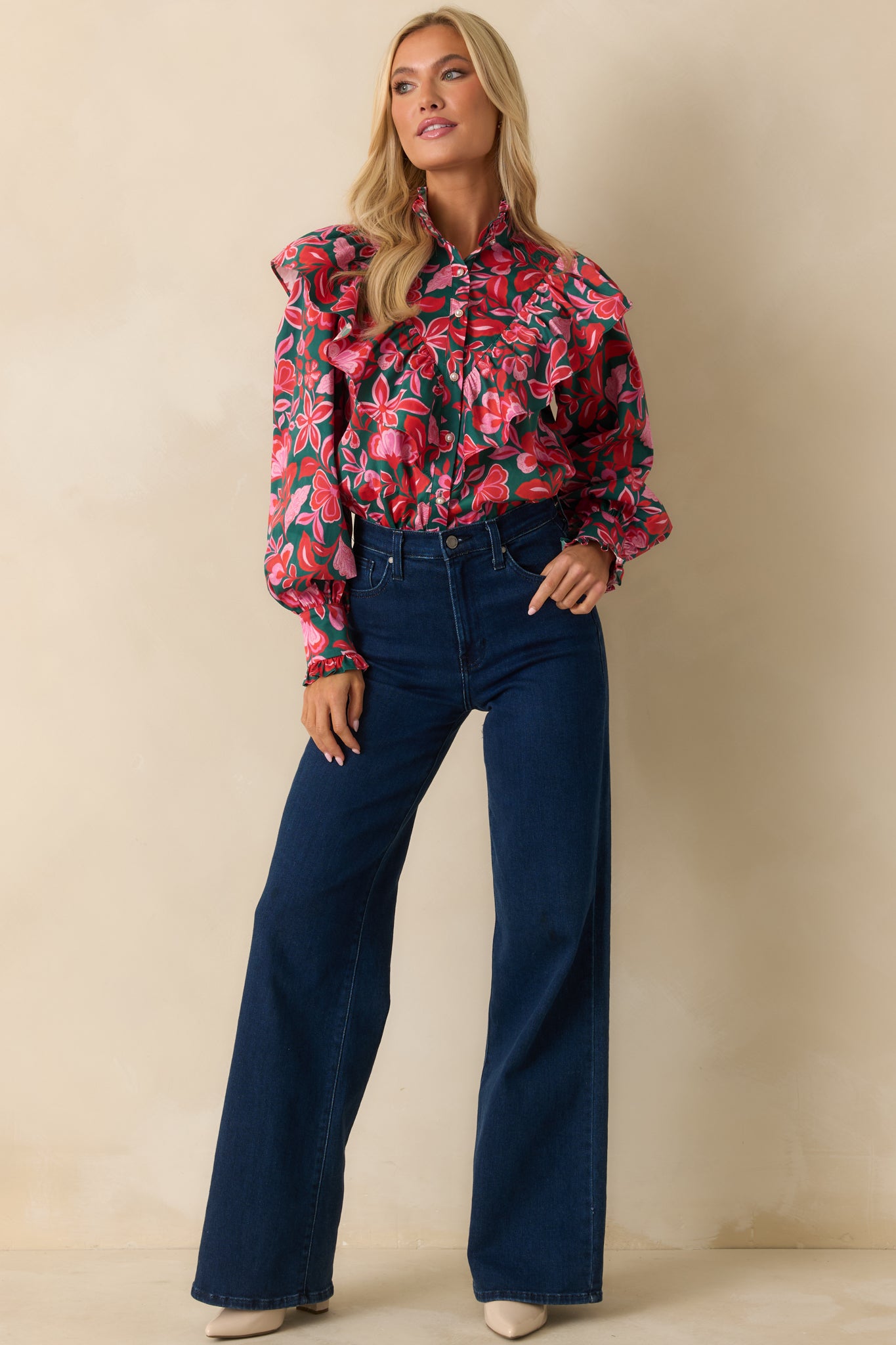 The button-front closure and layered ruffles create a feminine, flowing shape with subtle volume.