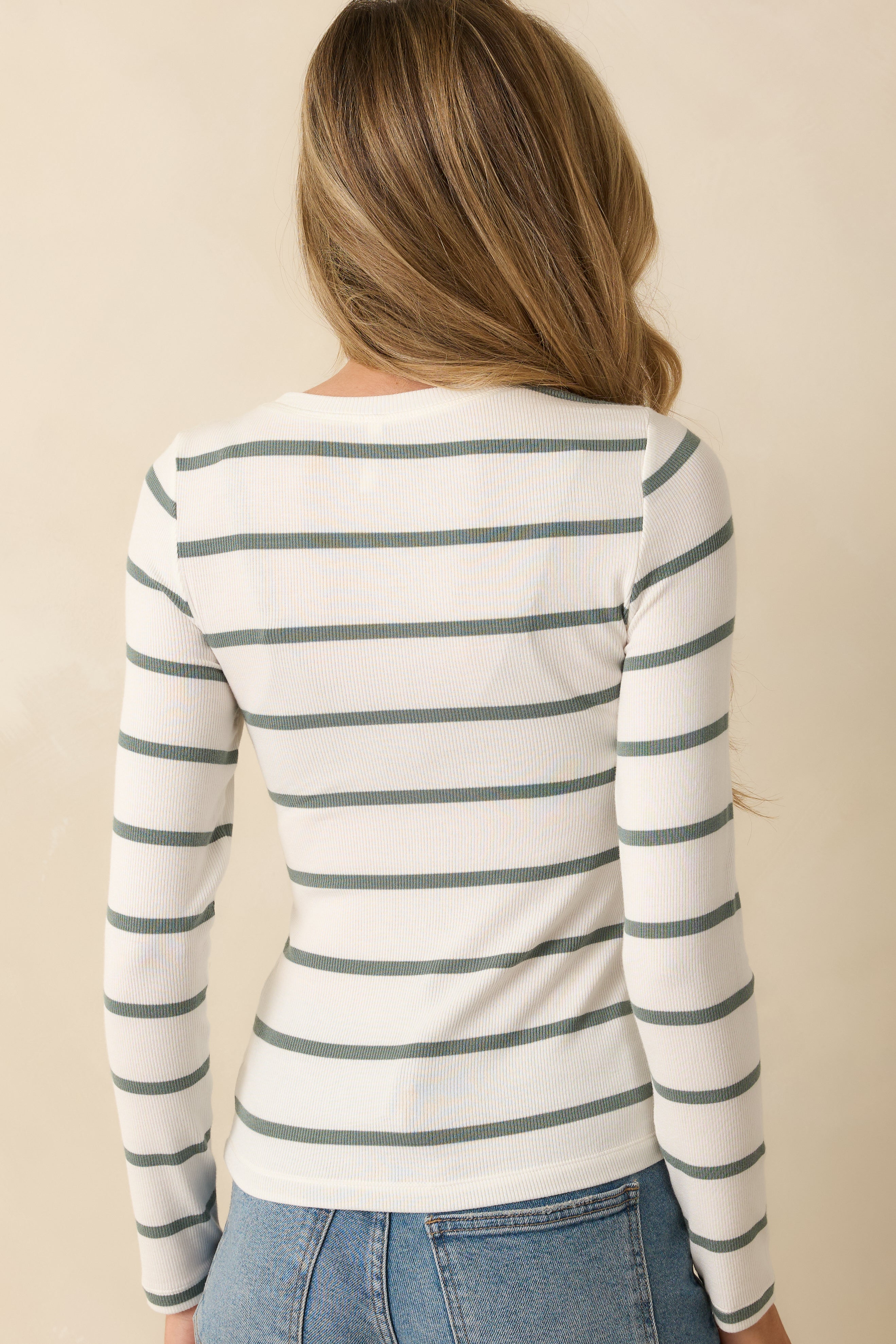 Back view of the top showing the scoop back neckline, long sleeves, and stripe pattern continuity.