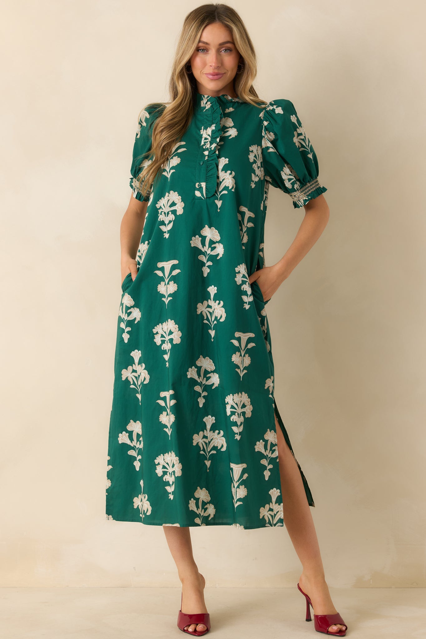 Front angle highlighting the maxi length, side seam hem slits, and functional pockets.