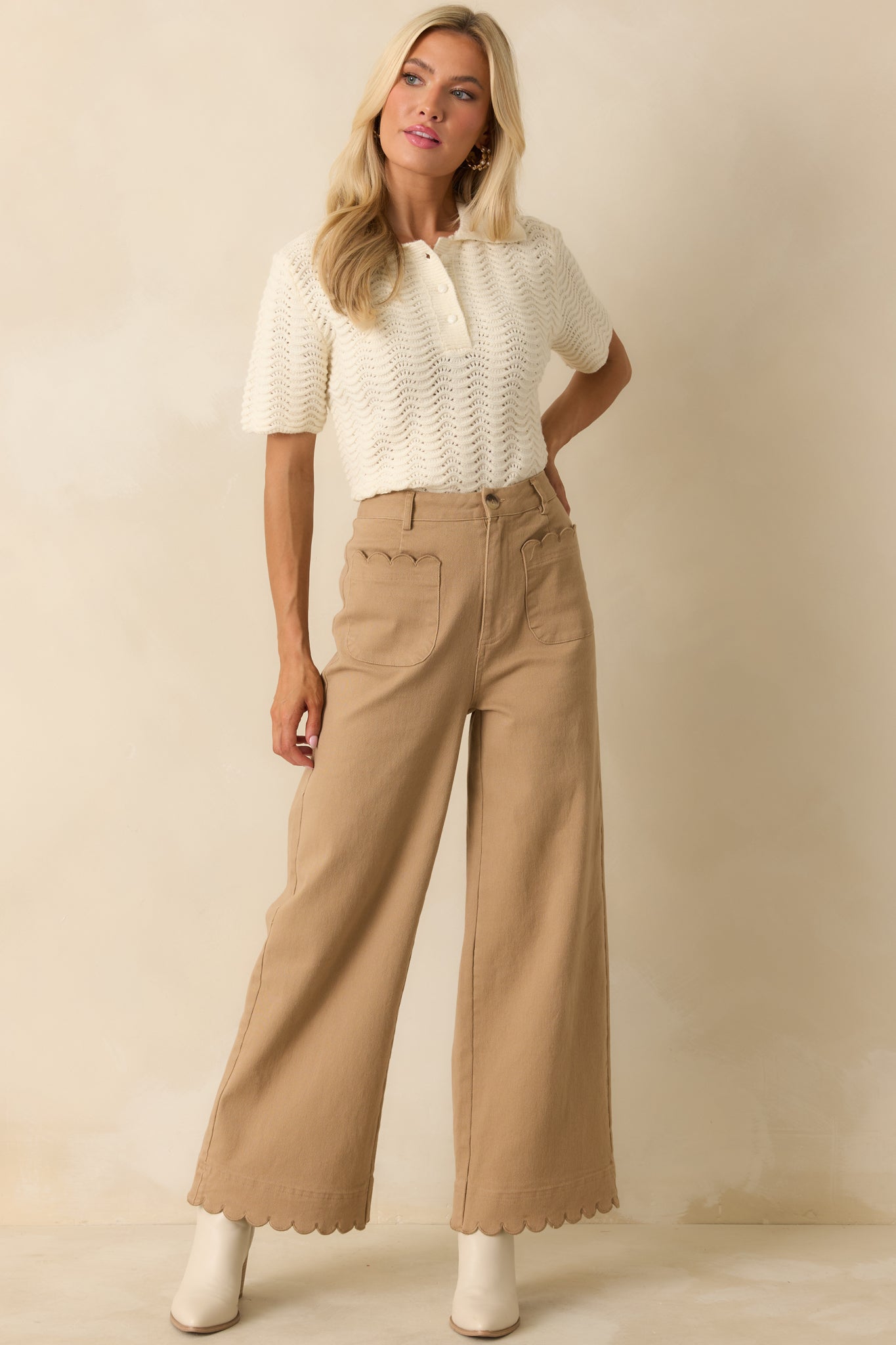 Front view of wide-leg pants featuring scalloped trim on patch pockets and hemline.