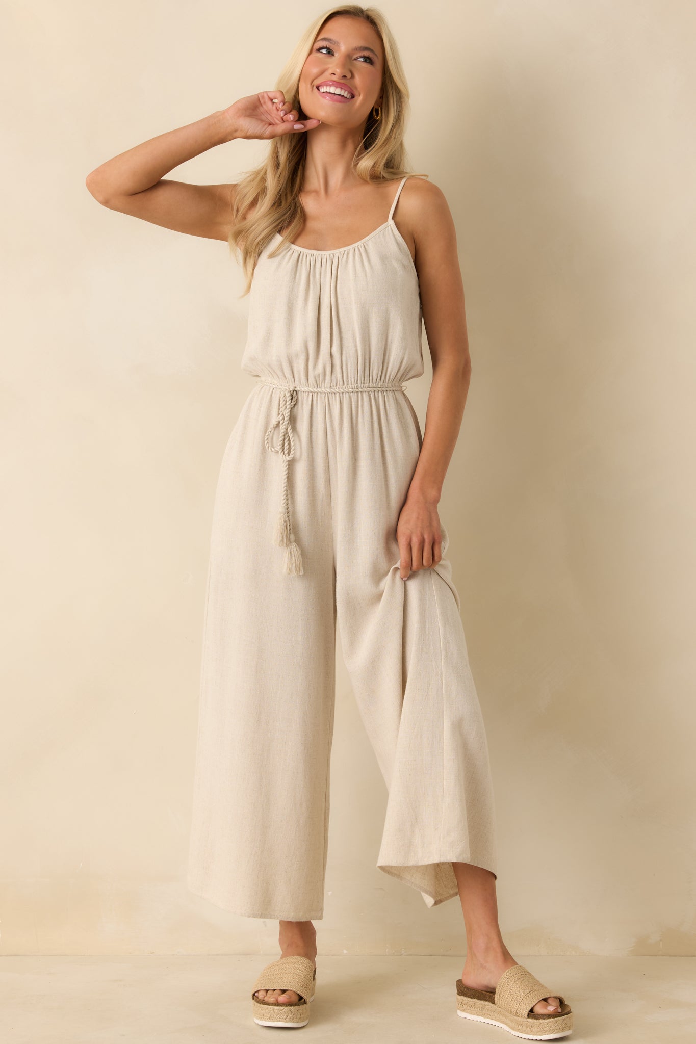 Jumpsuit emphasizing overall drape, strap details, and casual chic shape.