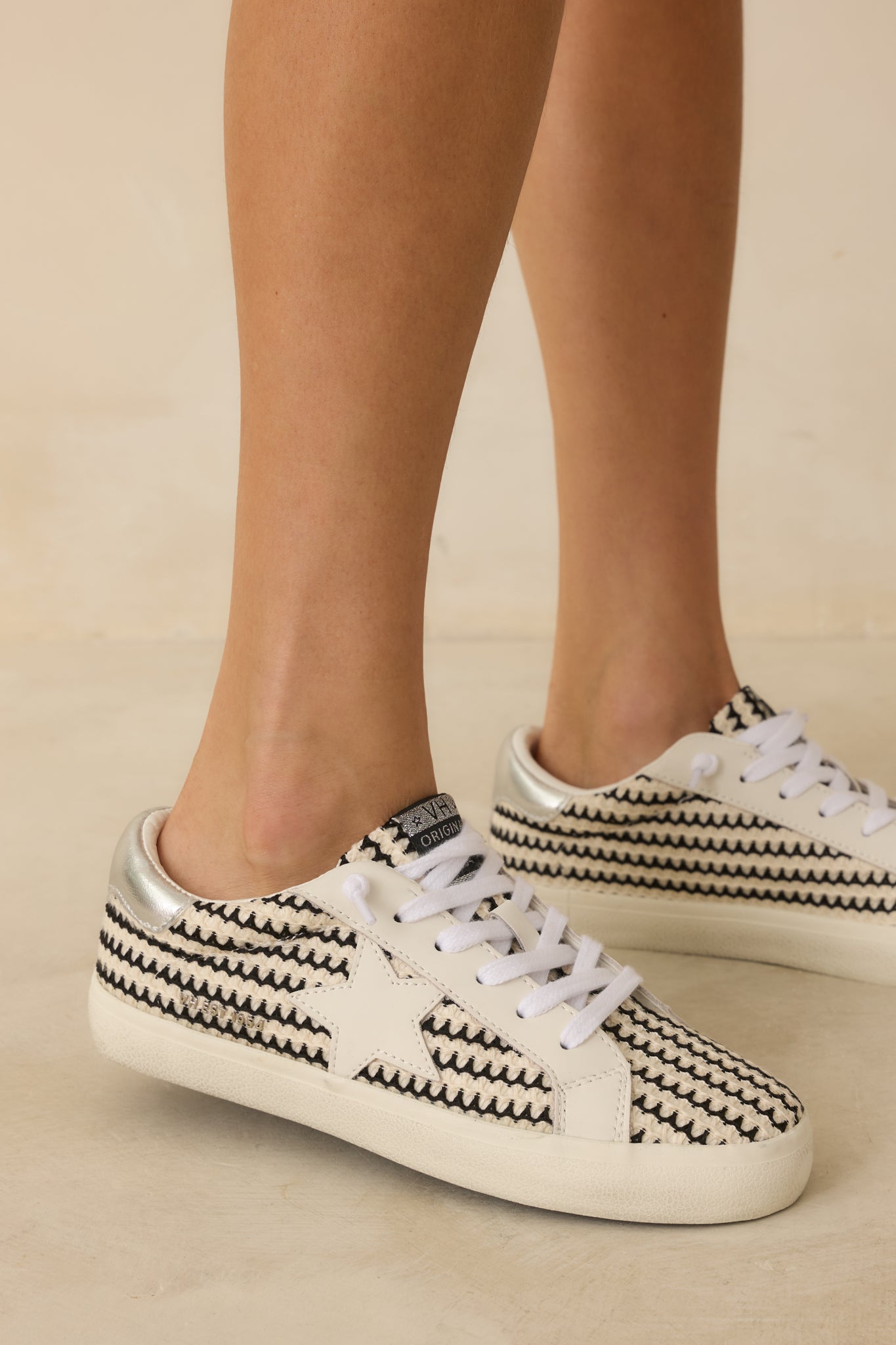 Cropped side detail focusing on the star detailing and color contrast between black and white panels.