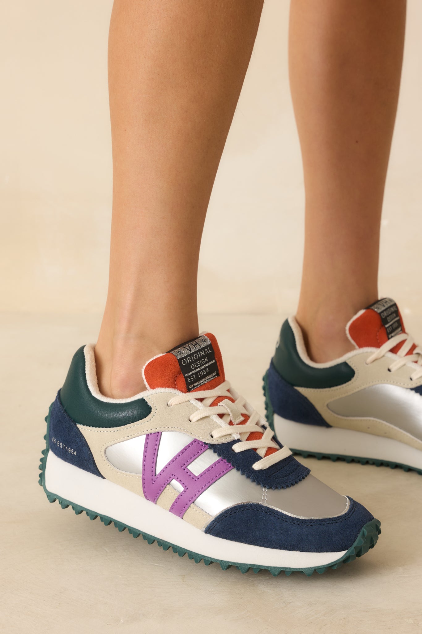 Three-quarter front angle highlighting the lace-up front, slight platform, and multi-color accents.