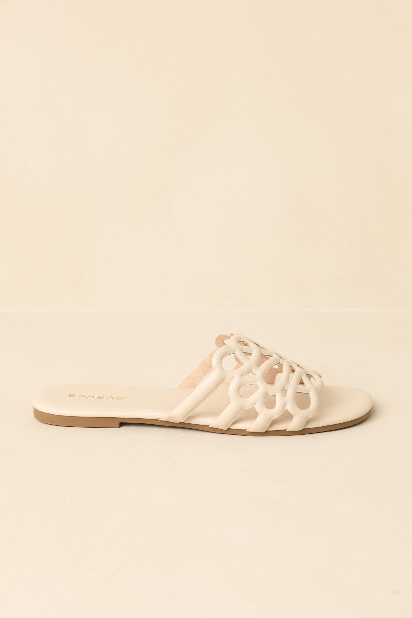 Side profile highlighting flat sole and easy slip-on silhouette.