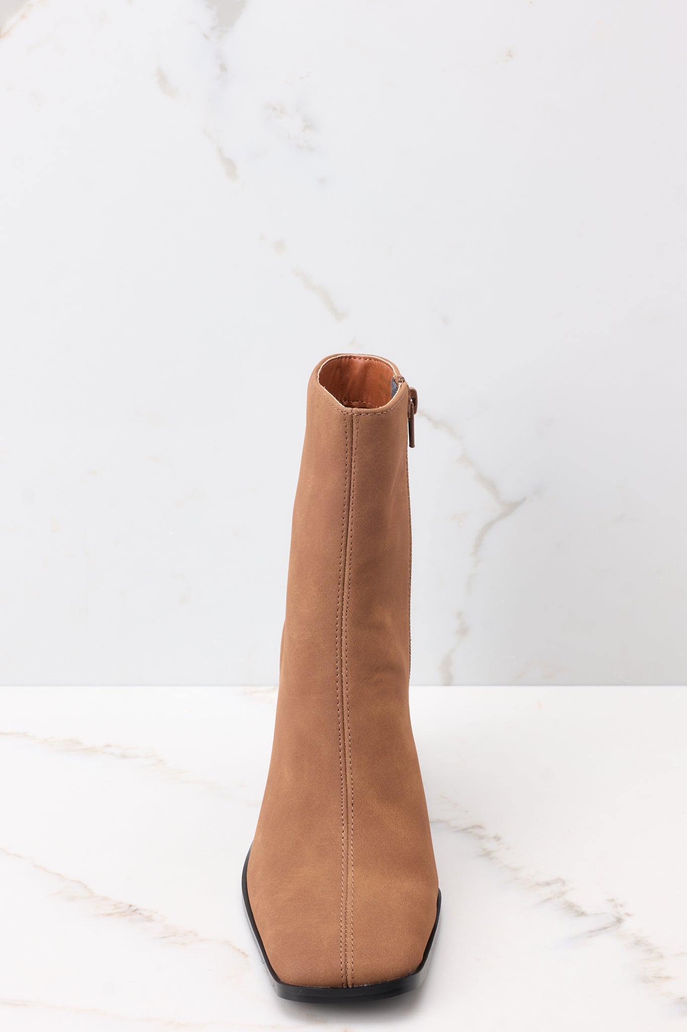 Front view of brown booties with a slightly squared toe.