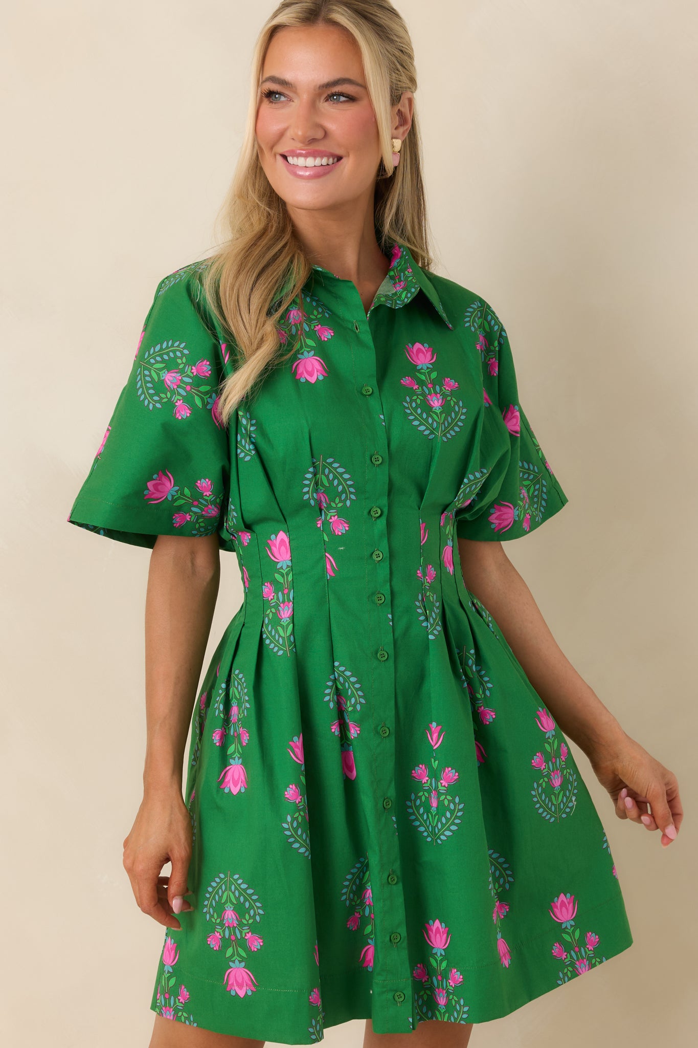 Mini dress fabric and stitching shown with subtle shaping through the waist.