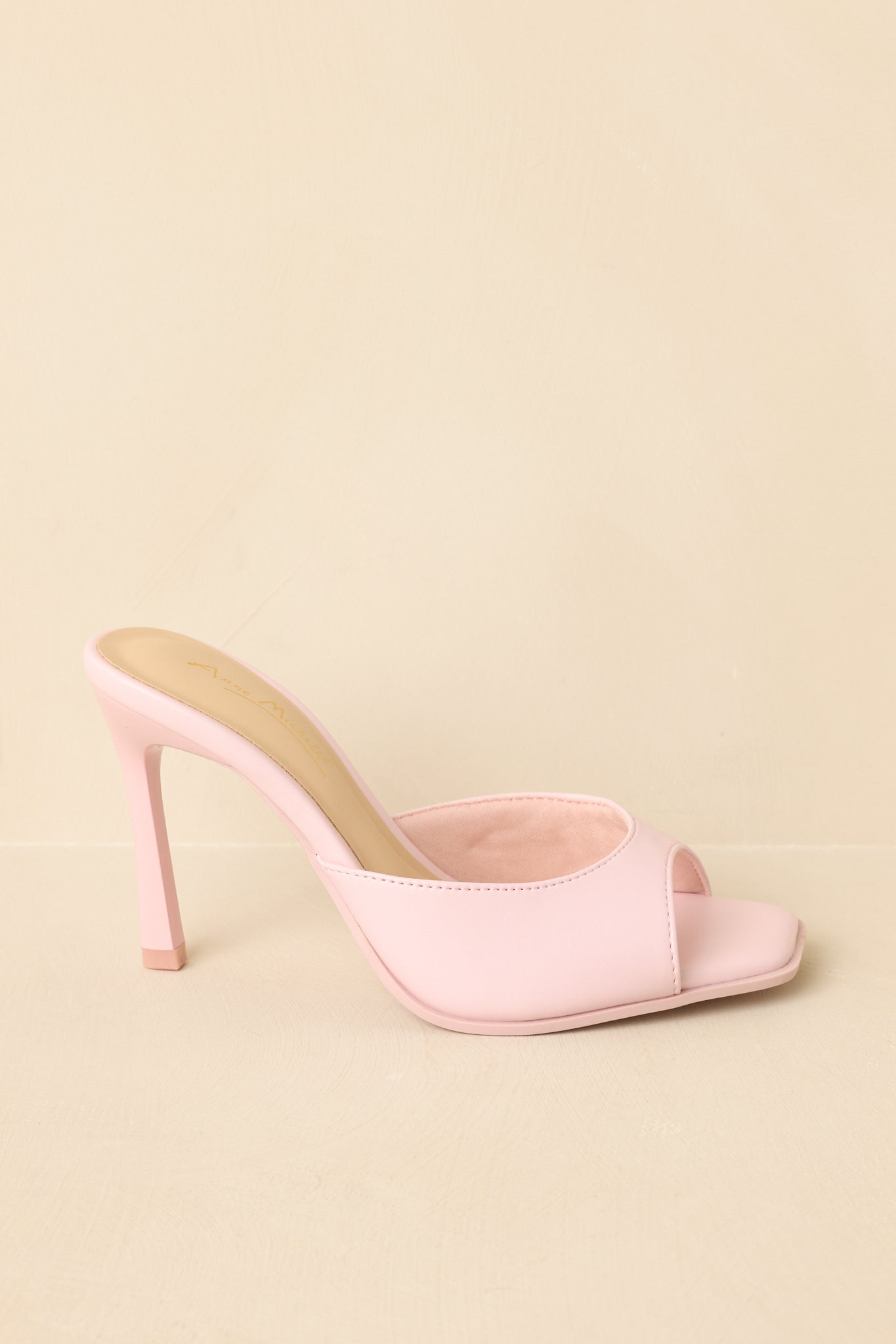 Side profile highlighting slim heel and slip-on design.