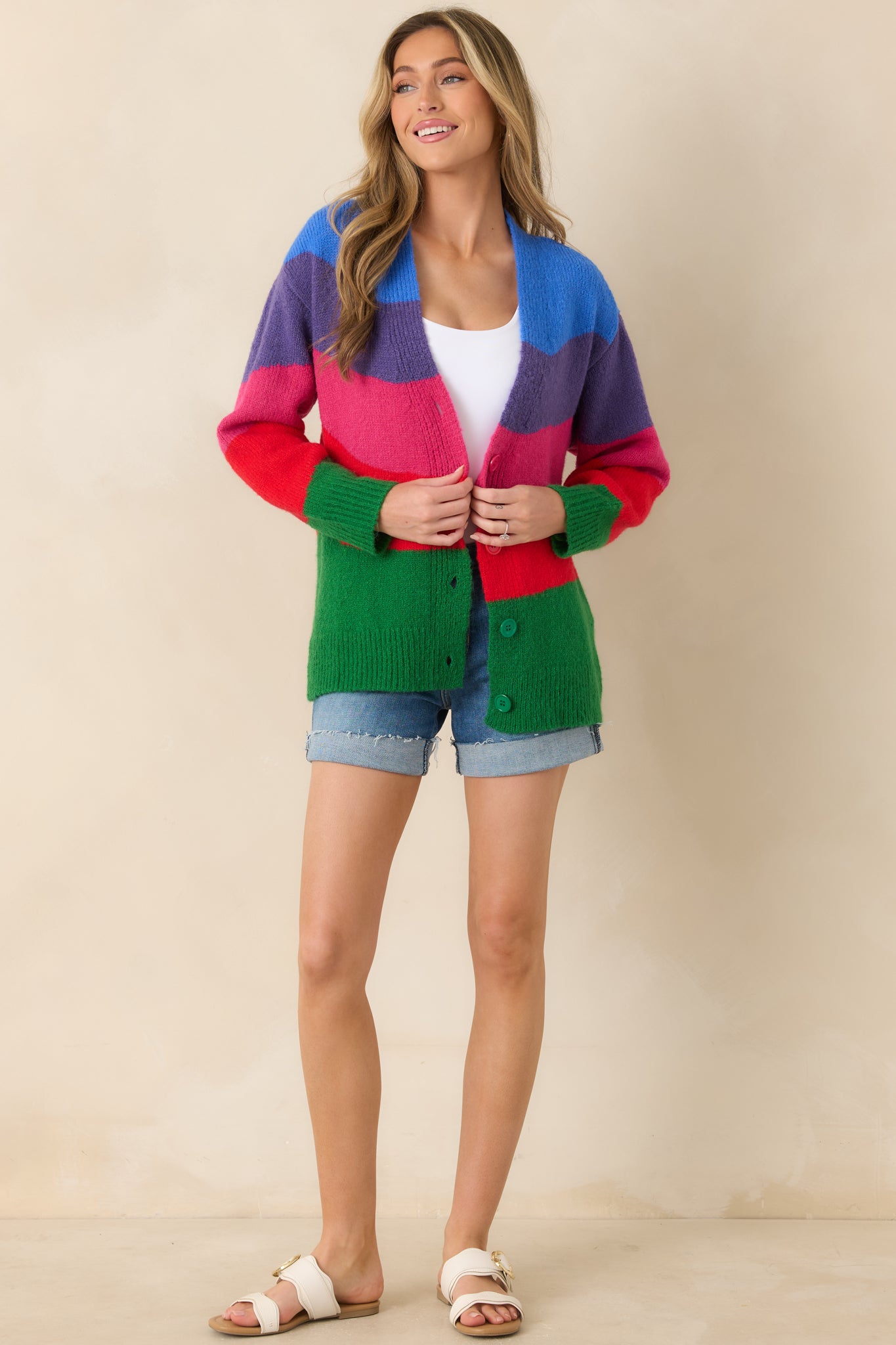 Multi colorblock knit cardigan featuring a V-neckline, button-front closure, and relaxed silhouette designed for easy layering.