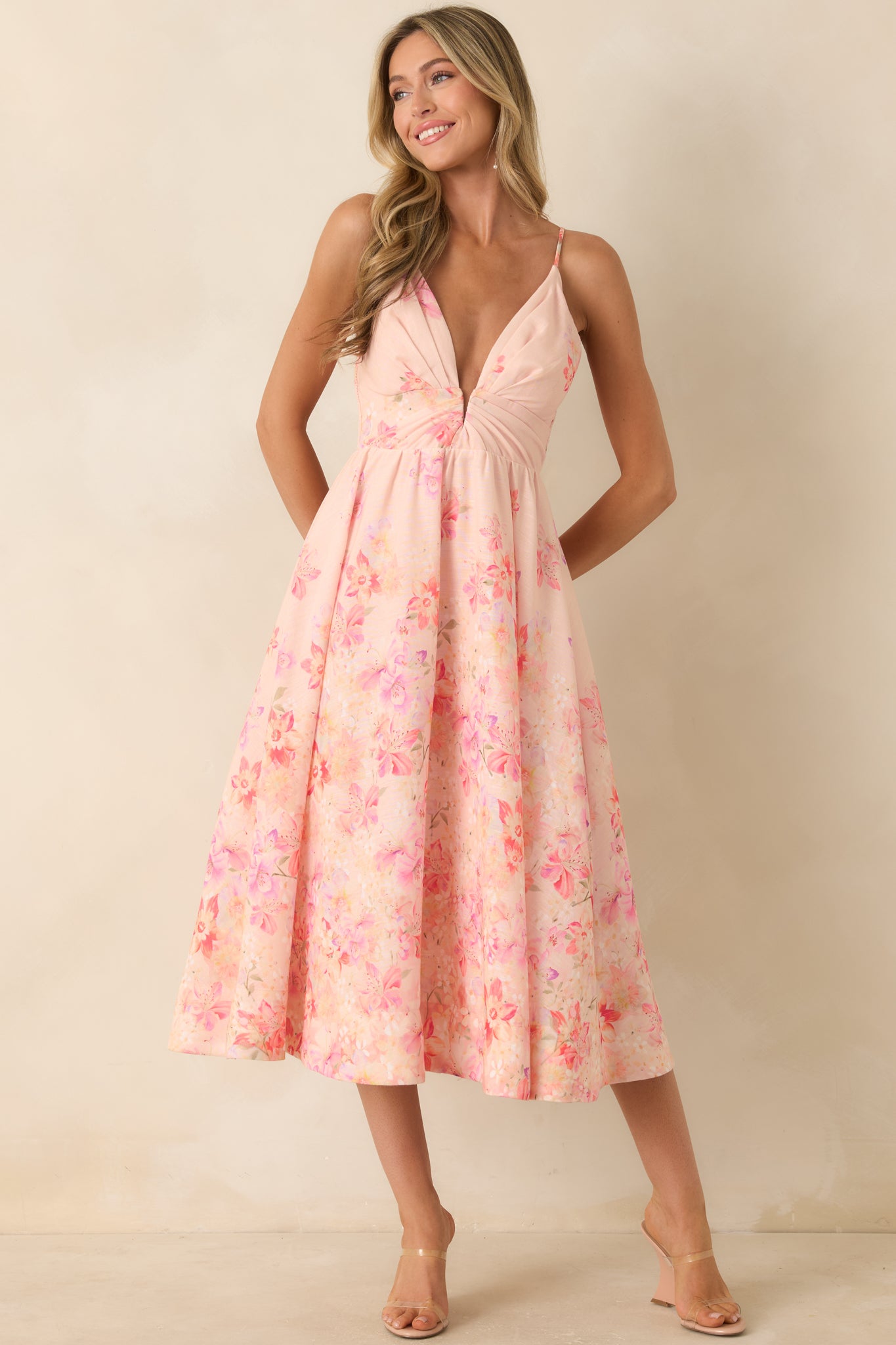 Flowing midi dress showcasing a gathered front detail and a relaxed, airy silhouette in lightweight fabric.