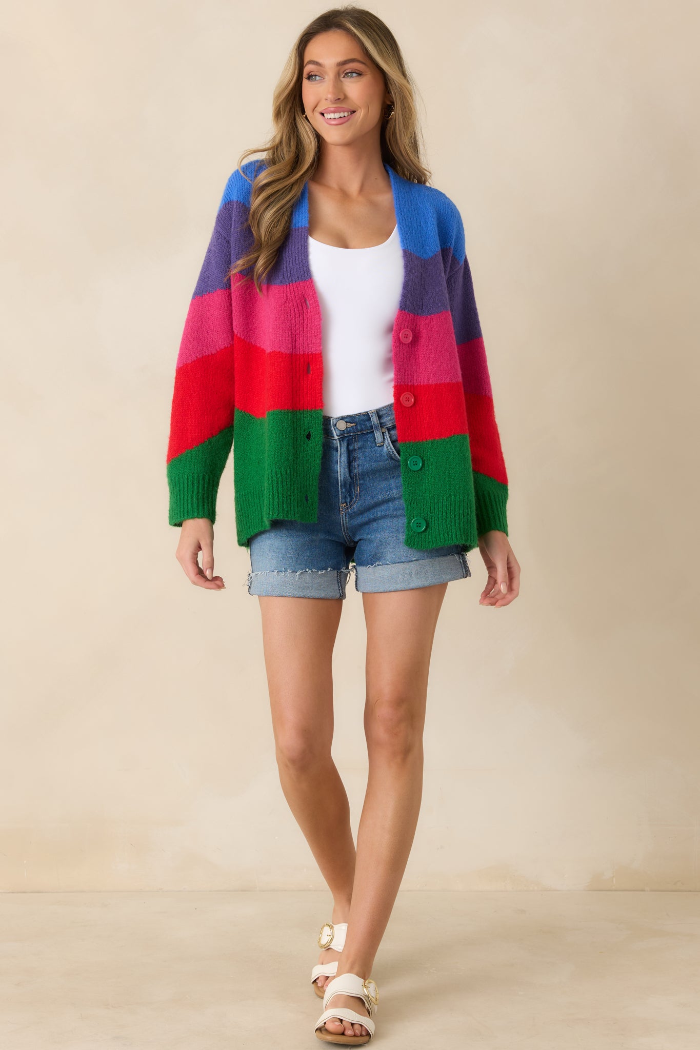 Soft knit cardigan with long sleeves, ribbed cuffs, and a polished ribbed hem for a comfortable structured finish.