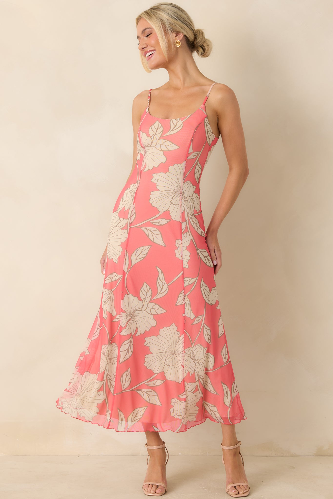 Coral pink midi dress with delicate floral mesh overlay, adjustable spaghetti straps, and a breezy layered silhouette over a beige lining.