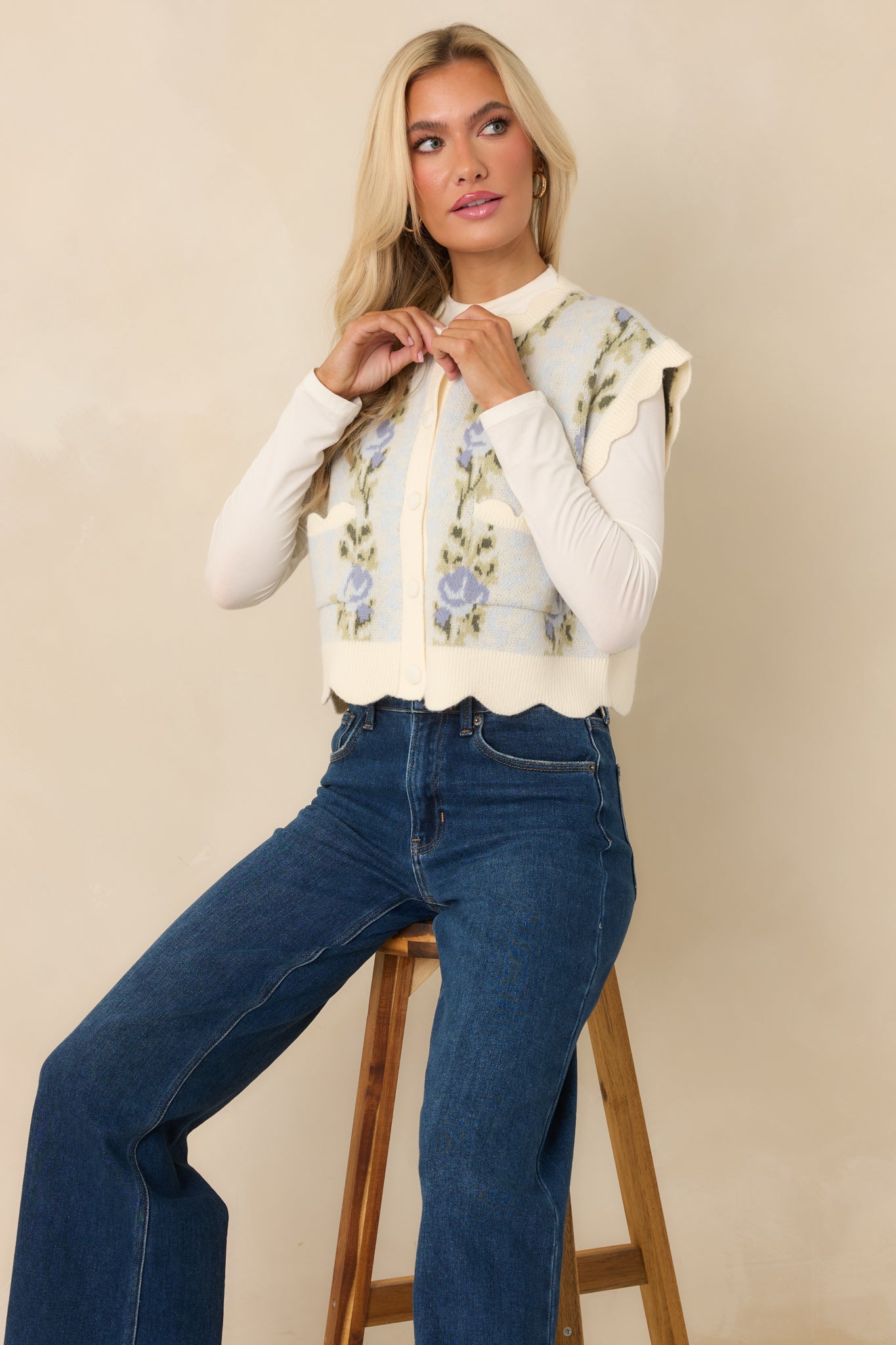 Cropped view emphasizing the button-front closure and ribbed texture of the light blue floral vest.