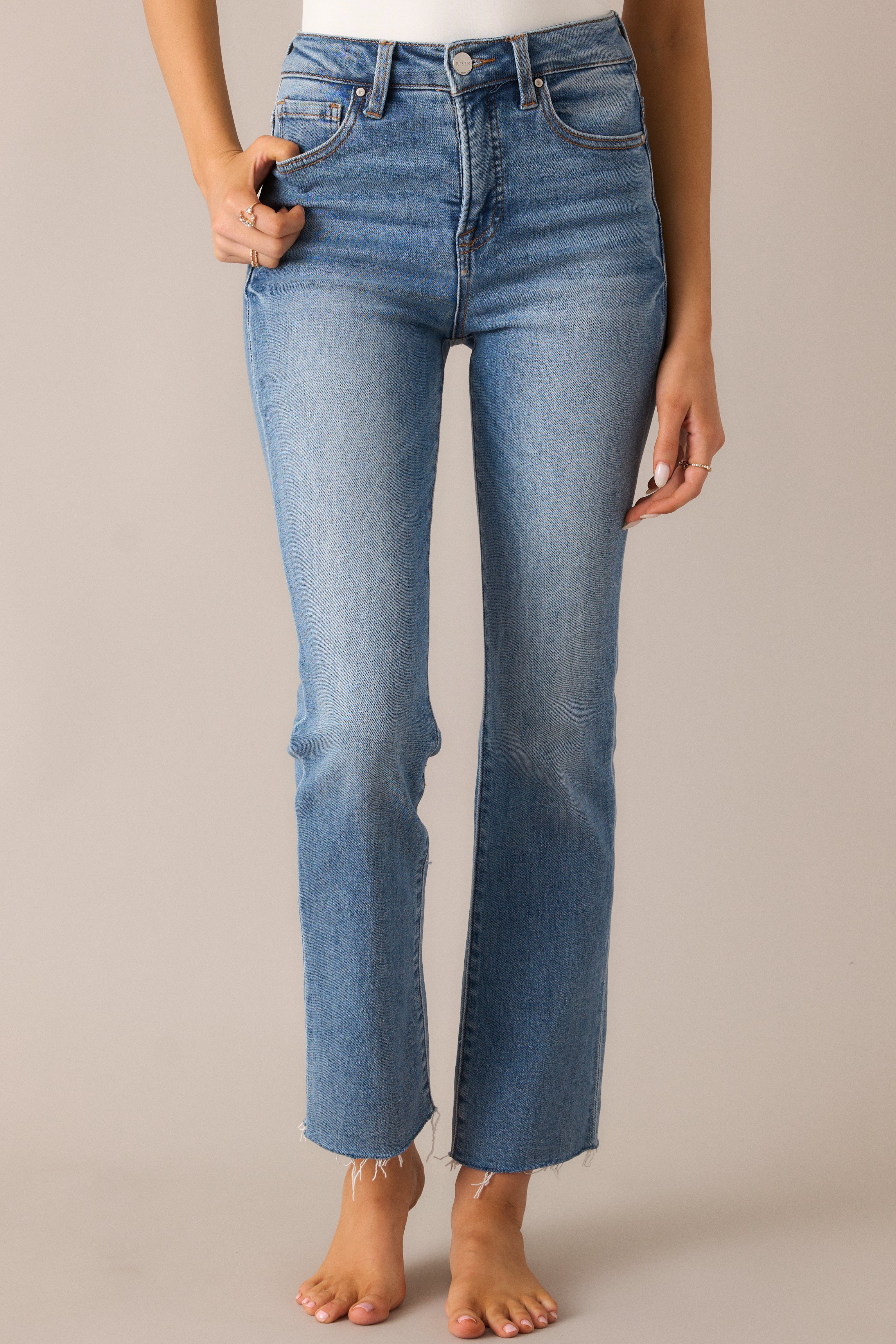 Close-up of the jeans’ high waist and functional belt loops, highlighting the sleek design and structured fit that flatters the body.