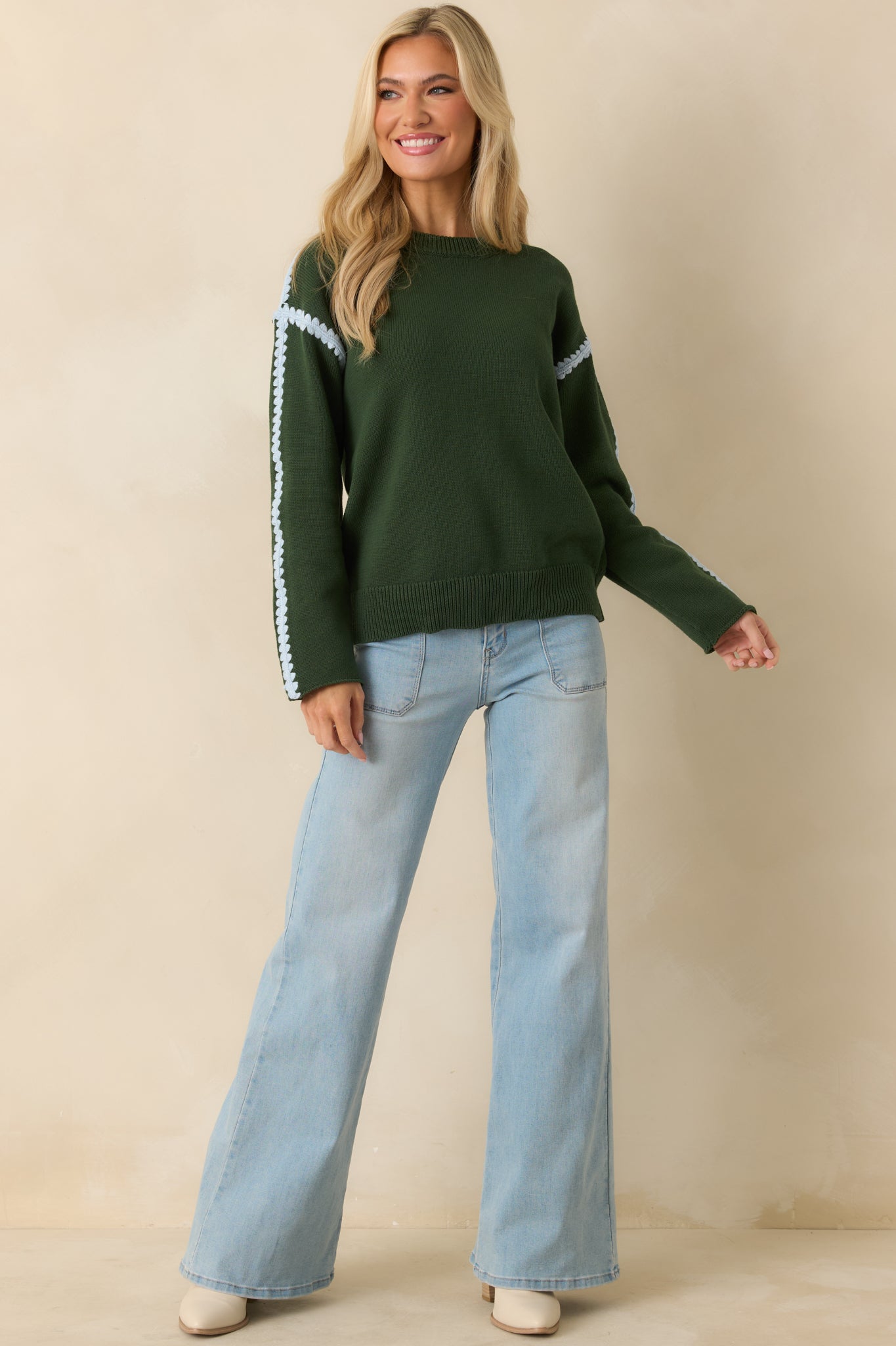 Moss green cotton knit sweater with a classic crew neckline and ribbed hem finish.