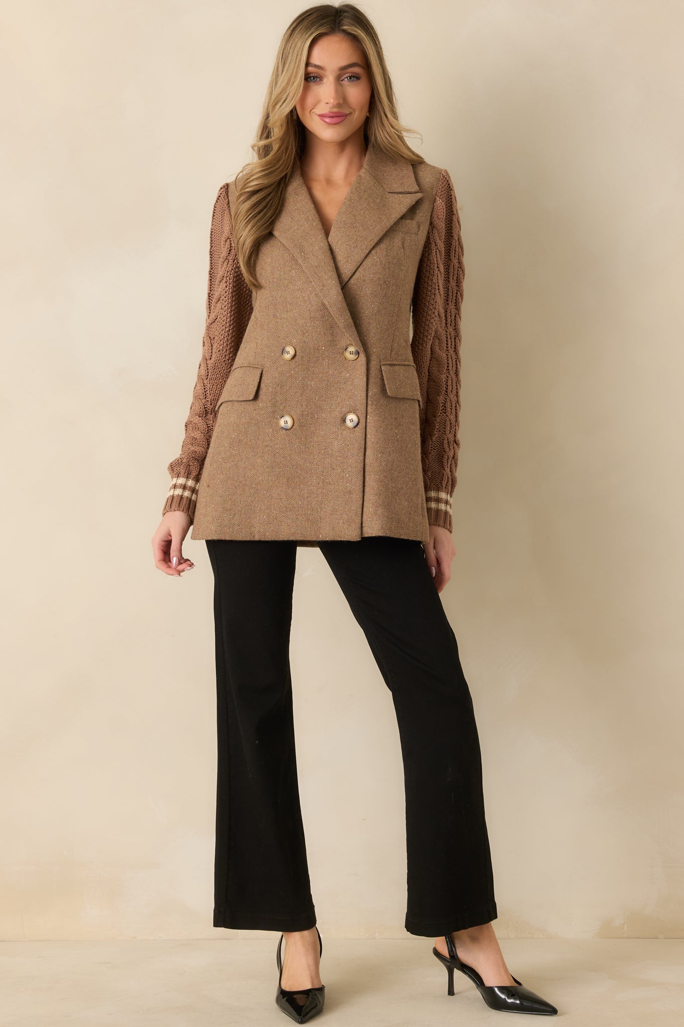 Wool-blend camel blazer shown at mid-thigh length with balanced proportions and classic lapel shaping.
