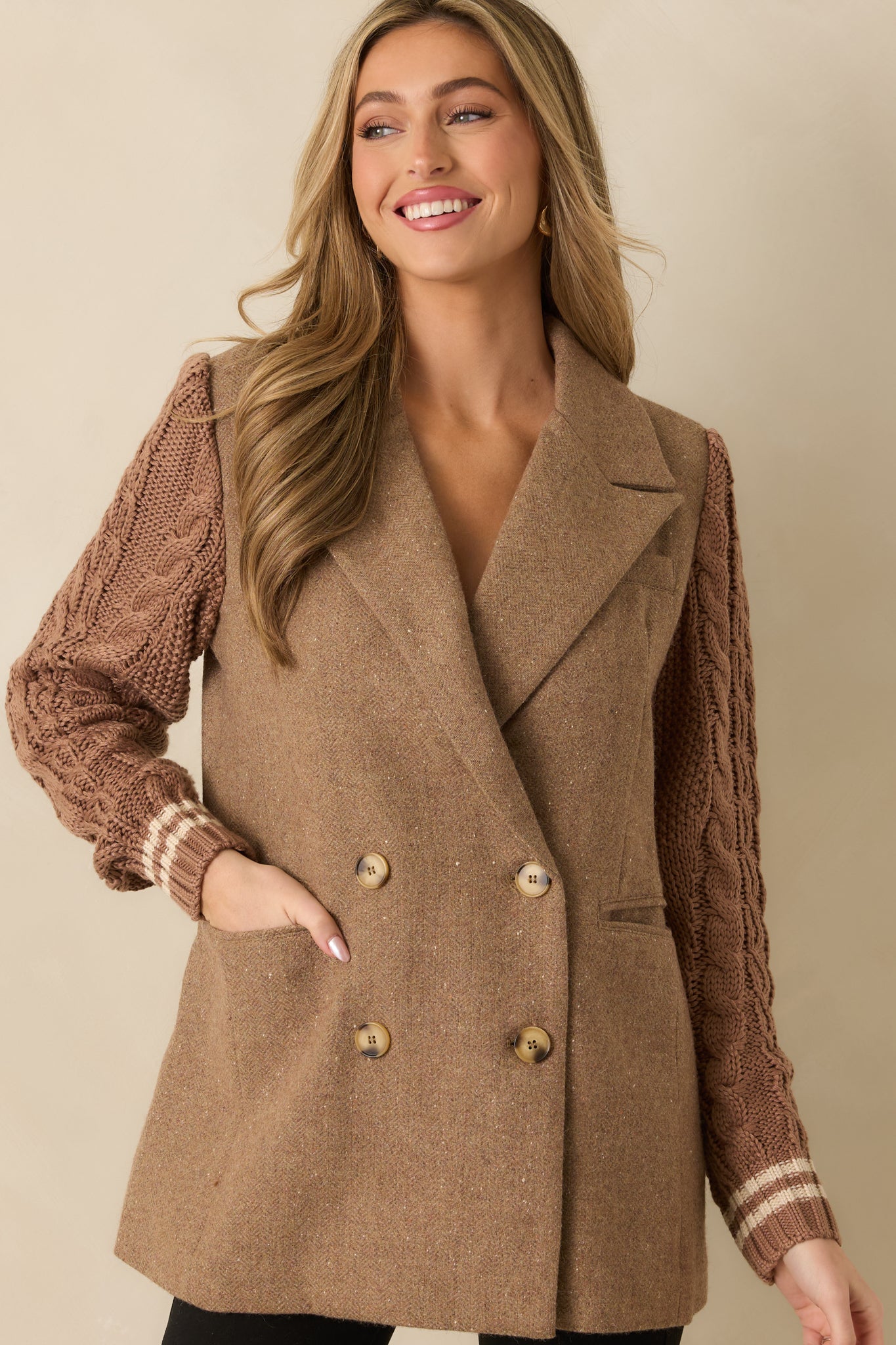 Close view of the textured knit sleeves paired with the structured wool-blend body.