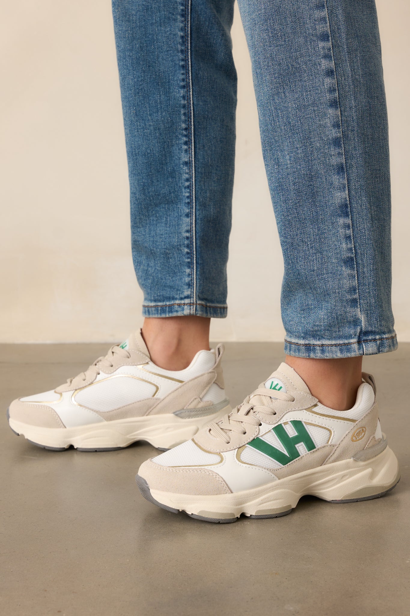 Side view of the green sneakers showing the large VH logo on the side and thick beige sole with grey accents on the bottom.