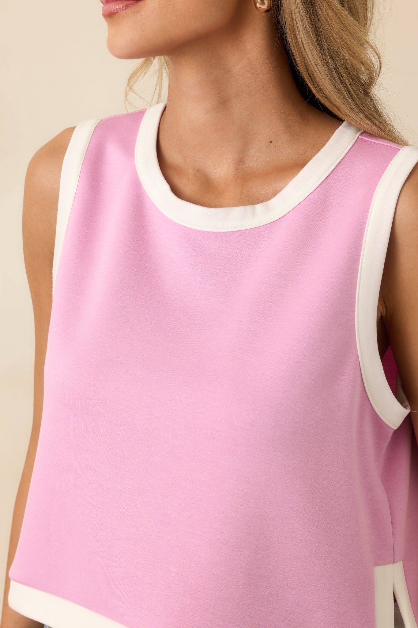 Fine orchid pink stretch knit with sharp contrast ribbed trim stitching.